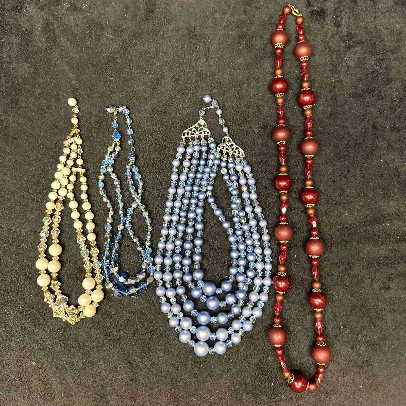 Four Assorted Style Costume Jewelry Necklaces K60: Costume Jewelry Necklace Set Lot of Four Necklaces. Various costume jewelry necklaces, four pieces included with various unique designs and styles. Light noticeable wear throughout the necklace set. T