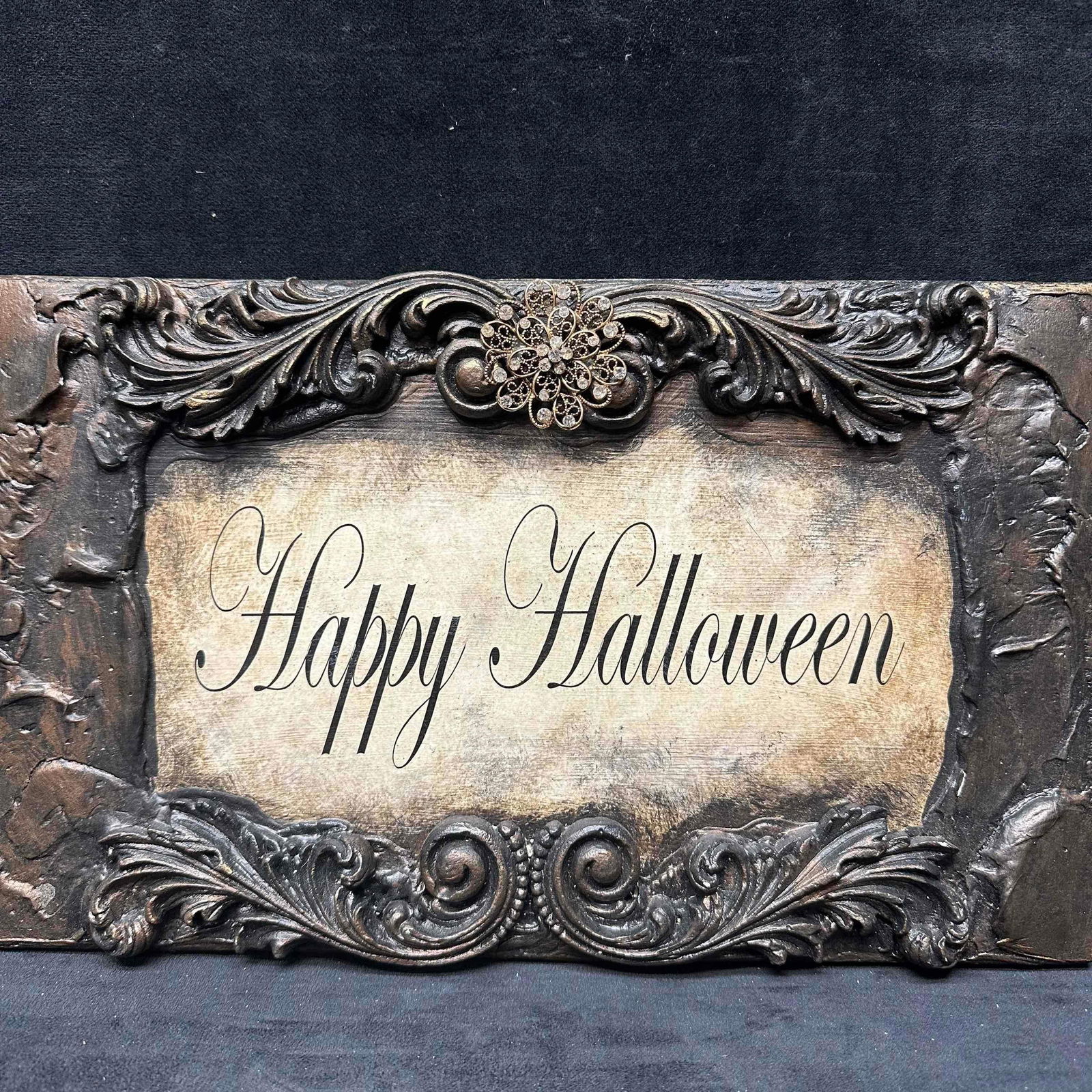 Michelle Butler Designs Happy Halloween Plaque Sign Decor: Happy Halloween hand crafted decor piece. Minor chips on resin wood decor. Unique plaque hand crafted art piece featuring rhinestone accents. Signed by artist Michelle Butler on the back. This item is