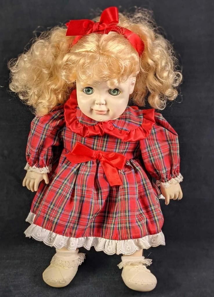 Living Legacy Baby Doll With Plaid Dress: Living Legacy Baby Doll With Plaid Dress. Vinyl head, arms, hands, legs, and feet with a plush body. Eyes close when laid down and open when up. Please note, the doll does not stand on its own. The do