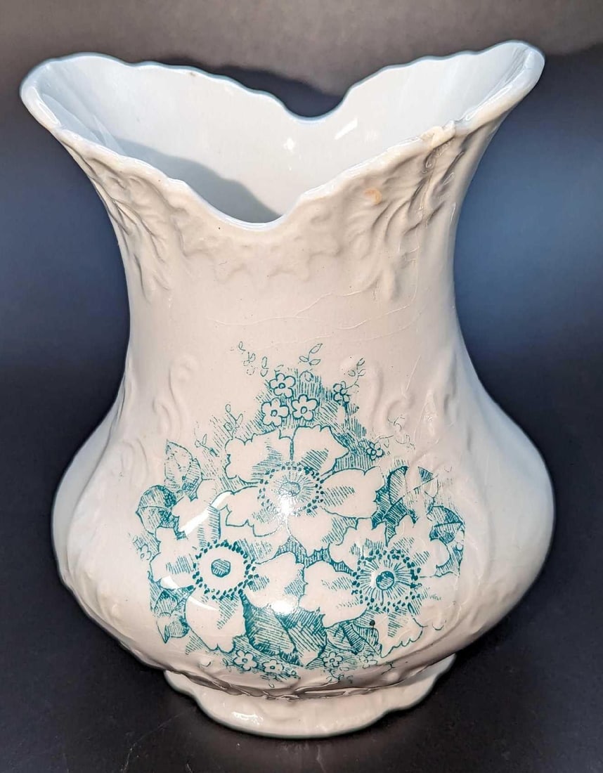 Vintage Green & White Floral China Vase: Vintage Green & White Floral China Vase. This is approx 4 1/2" x 4" x 5" and it weighs 0.62lb. The vase has some crazing and has an inside crack near the top. There is a marking on the bottom, but the