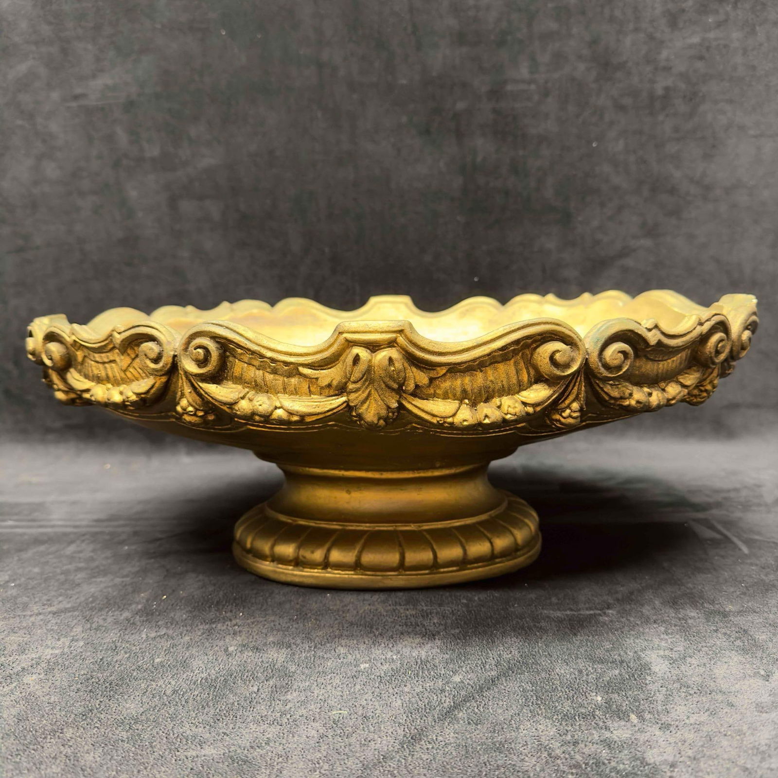 Terracotta Decorative Gold Brushed Footed Bowl Urn Pottery Plaster: Terracotta Decorative Gold Brushed Footed Bowl Urn. This decorative gold pottery bowl has nice detail. Could be used for indoor or outdoor with it's heavy duty build. A few small chips an noticeab