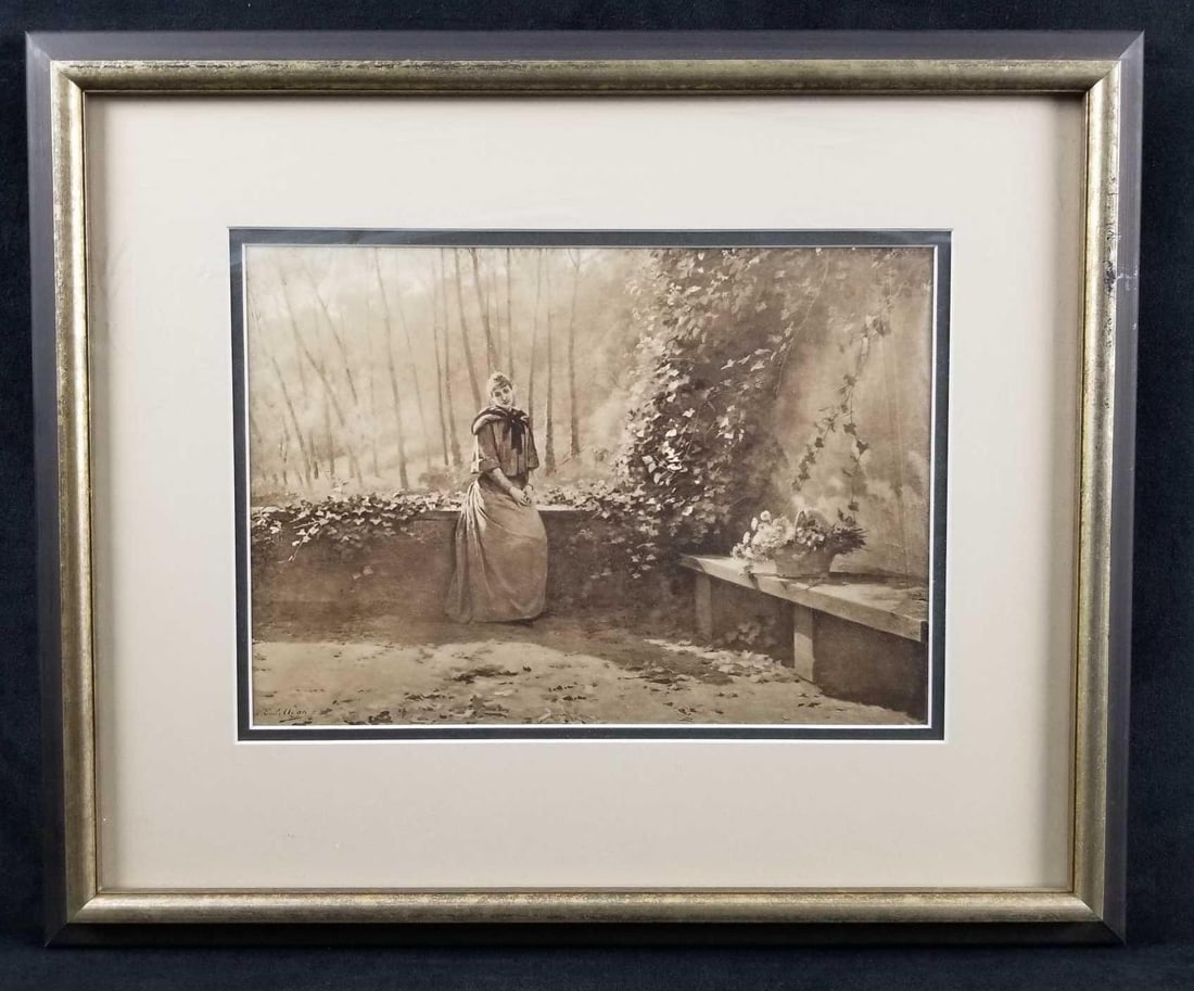 Vintage Emile Adan Framed Sepia Print: Vintage Emile Adan sepia tone print depicts a madame with a peaceful expression in a garden. Date is unknown. Double matted in black and ivory with a metallic and dark brown frame. In very good used