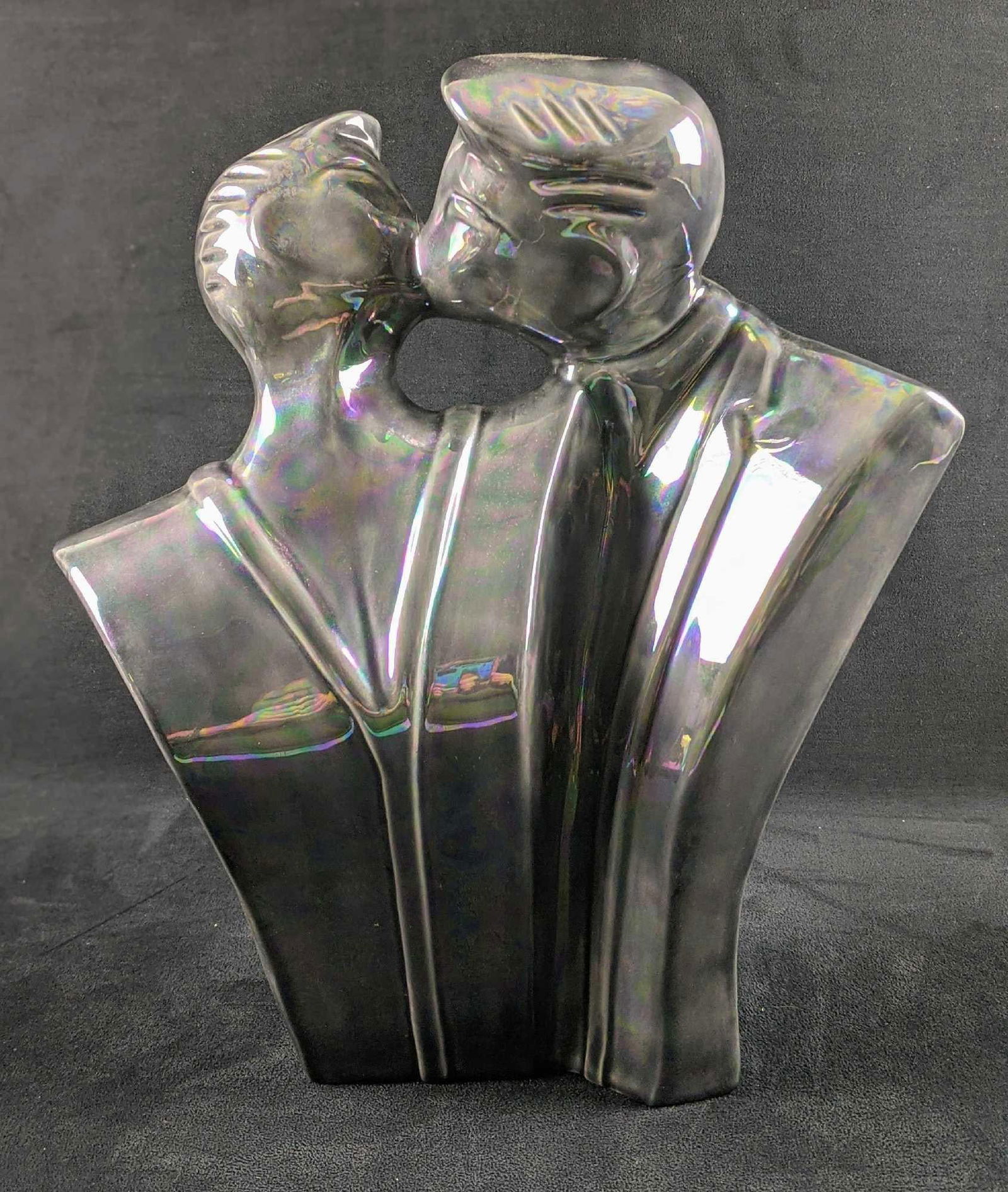 Iridescent Ceramic Couple Kissing Lindsey B Style: A beautiful modernist sculpture of a couple kissing. In the style of iconic 1980’s ceramic artist Lindsey Balkweill. The sculpture was given an iridescent glaze, giving the piece a cool, metallic