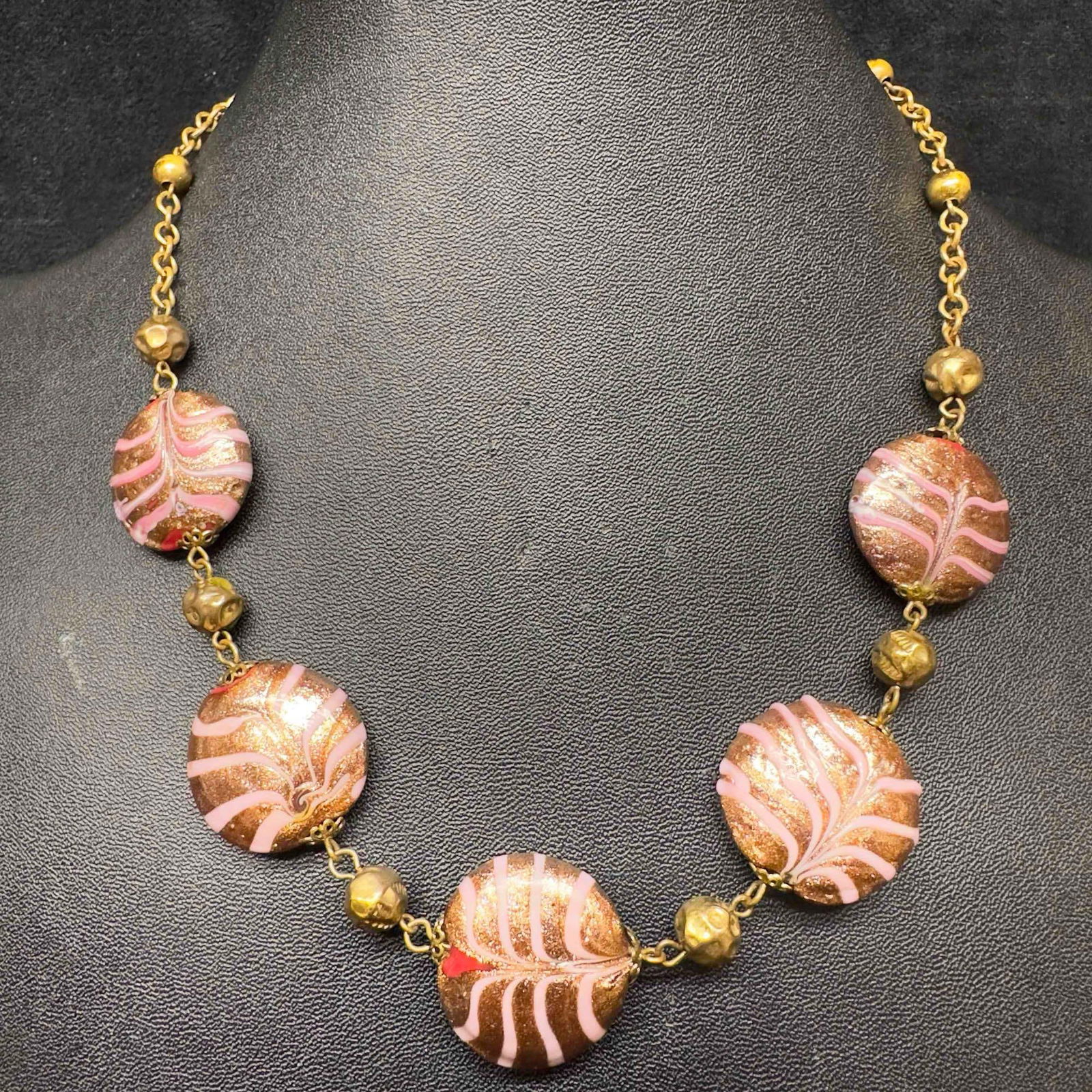 Murano Venetian Lamp Work Art Glass Pink Copper Red Circle Beaded Necklace C4: Murano Venetian Lamp Work Art Glass Pink Copper Red Circle Beaded Necklace C4. Necklace with red colored glass beads with beautiful hand painted designs on each. The necklace features copper and pink