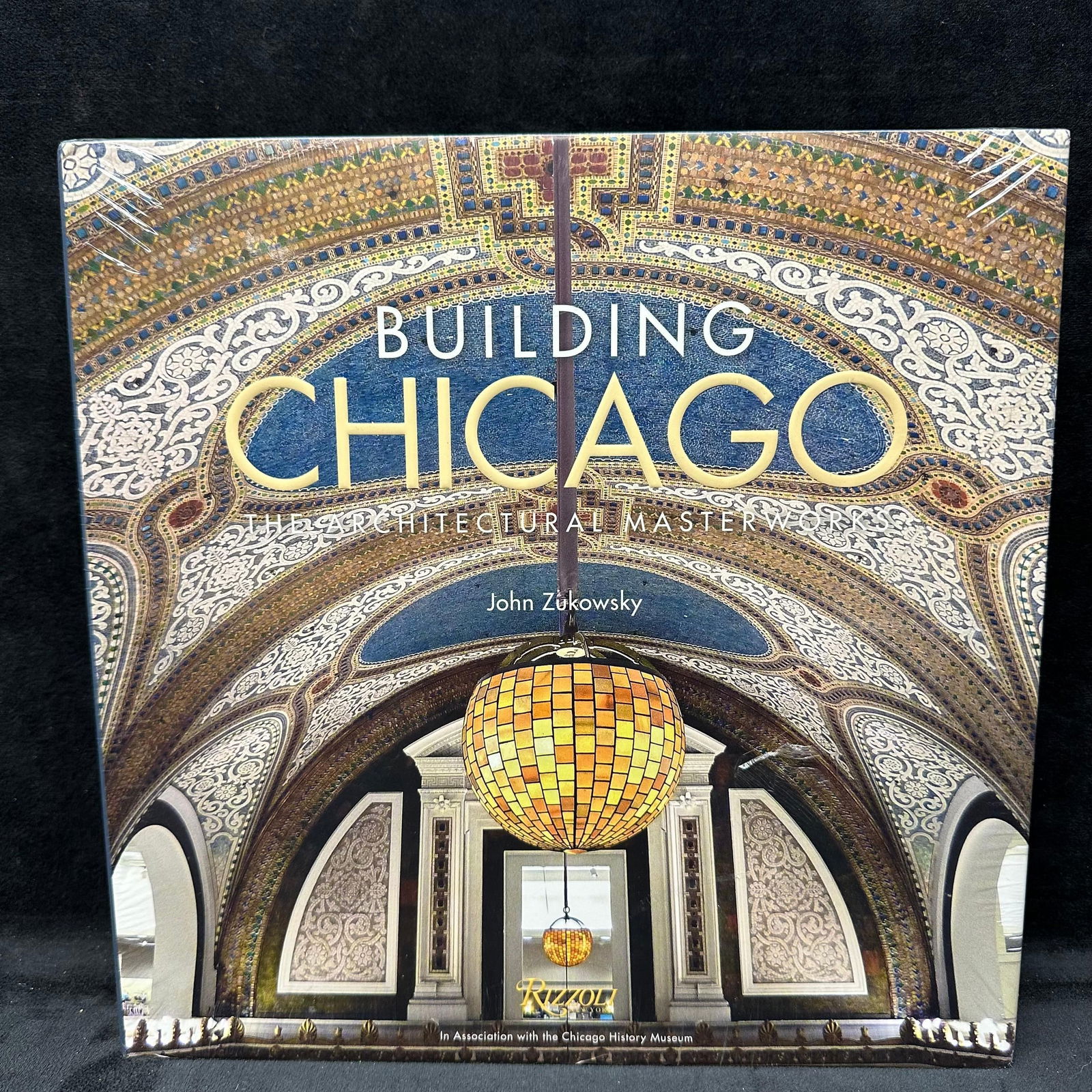 Building Chicago The Architectural Masterworks by John Zukowsky Hardcover Book: Sealed hardcover copy of Building Chicago: The Architectural Masterworks by John Zukowsky, published by Rizzoli in association with the Chicago History Museum. The book remains in its original shrink