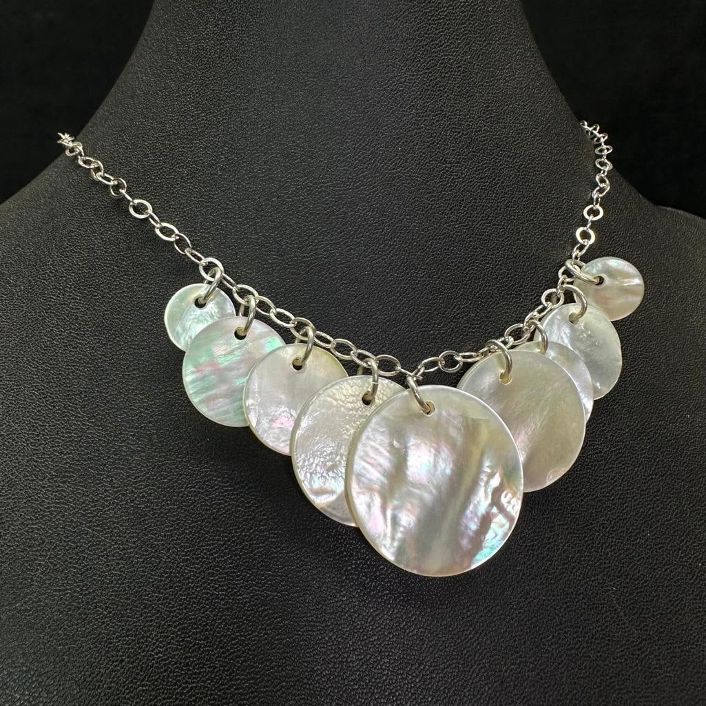 Sterling Silver Mother of Pearl Circles Necklace: This piece of jewelry has been tested and researched prior to listing. Please view all our pictures they are part of our description. DETAILS: Metal - Sterling SilverColor - SilverStones -