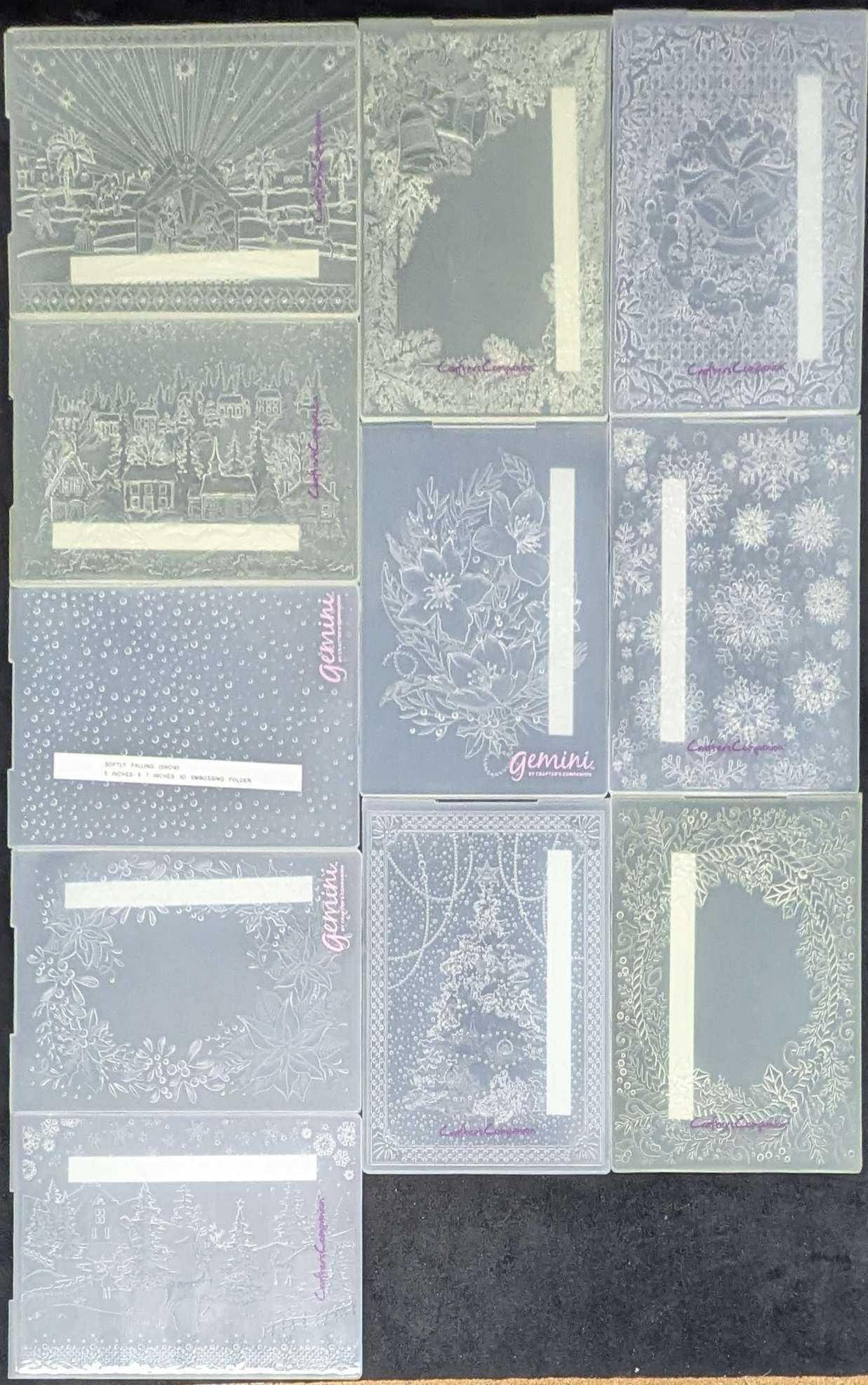 Gemini And Crafter's Companion Christmas Themed 3D Embossing Folders Lot Of 11: Gemini And Crafter's Companion Christmas Themed 3D Embossing Folders Lot Of 11. Each is approx 7" x 5" and the total weight is 1.70lb. An embossing folder is a plastic folder with a rais