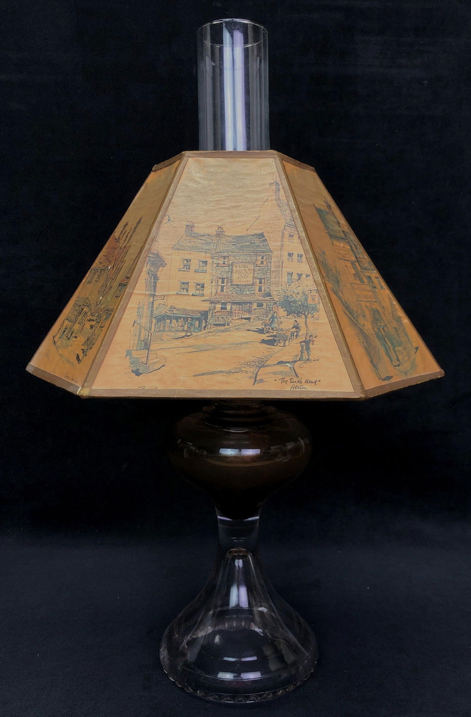 VTG Oil Lamp & Philip Bawcombe Watercolor Shade: Vintage Oil Lamp with Artist Philip Bawcombe Watercolor Shade. Shade features watercolors of old English Inns. The Vintage Lamp is approximately 19" x 12-1/2" x 12-1/2" and weighs about 2.5lbs. Overal