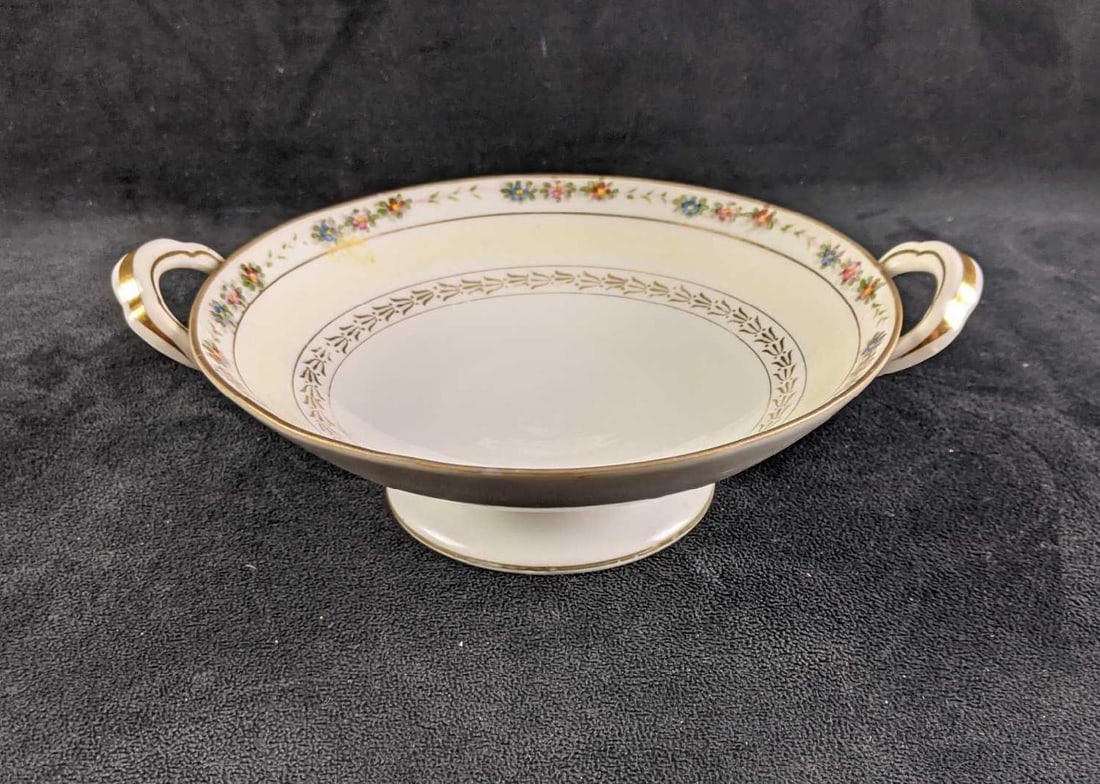 Ceramic Hand Painted Serving Bowl: This hand-painted bowl is from Nippon. This bowl has some age damage such as faded paints and discoloration. Overall this bowl is in good condition with no known cracks or chips. This bowl has hand-pa