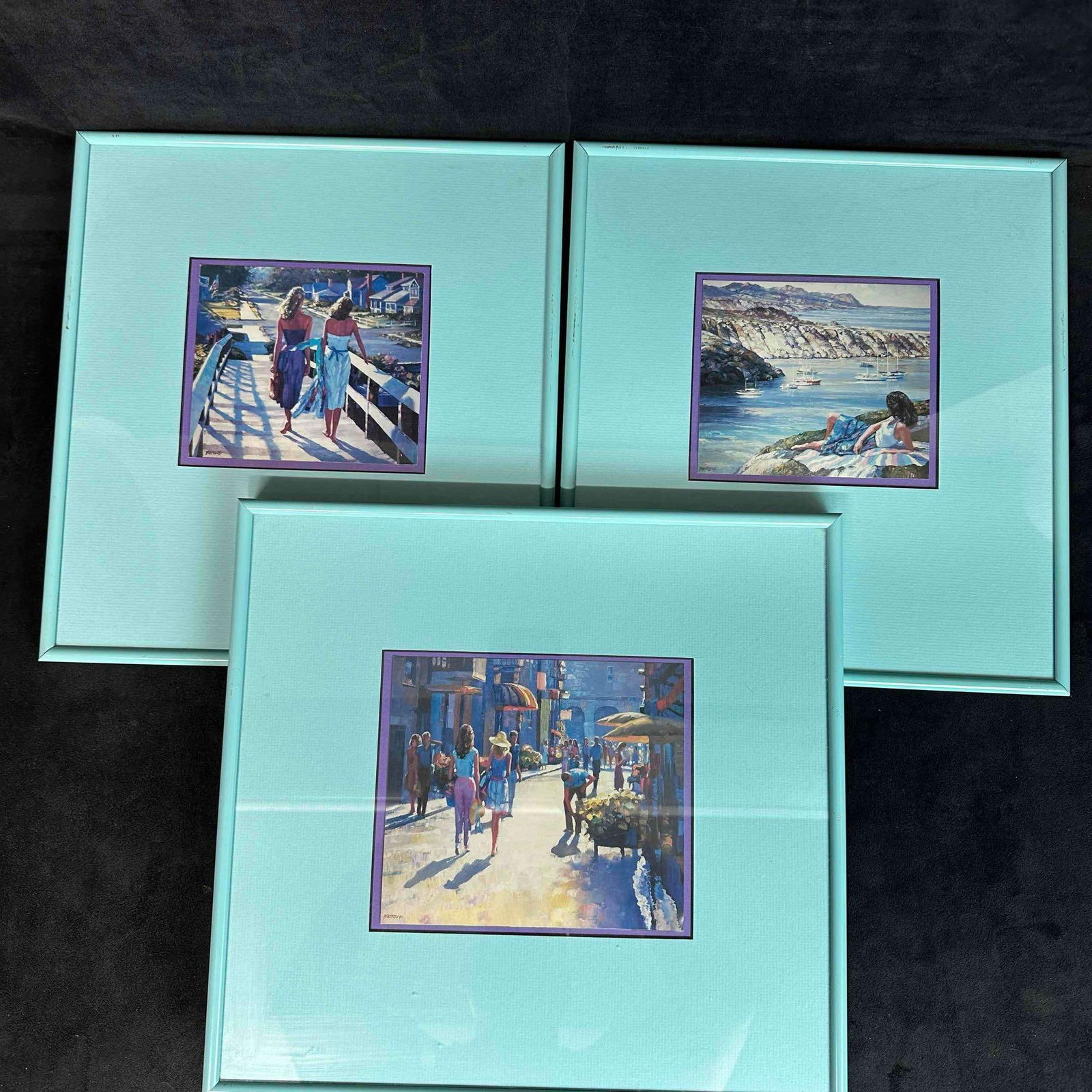 Howard Behrens Offset Lithograph Artwork Set Three Framed Lithographs: This set of three offset lithographs by Howard Behrens capture the tranquil essence of coastal life. One piece depicts two women strolling along a sunlit boardwalk. The second piece artwork portrays a