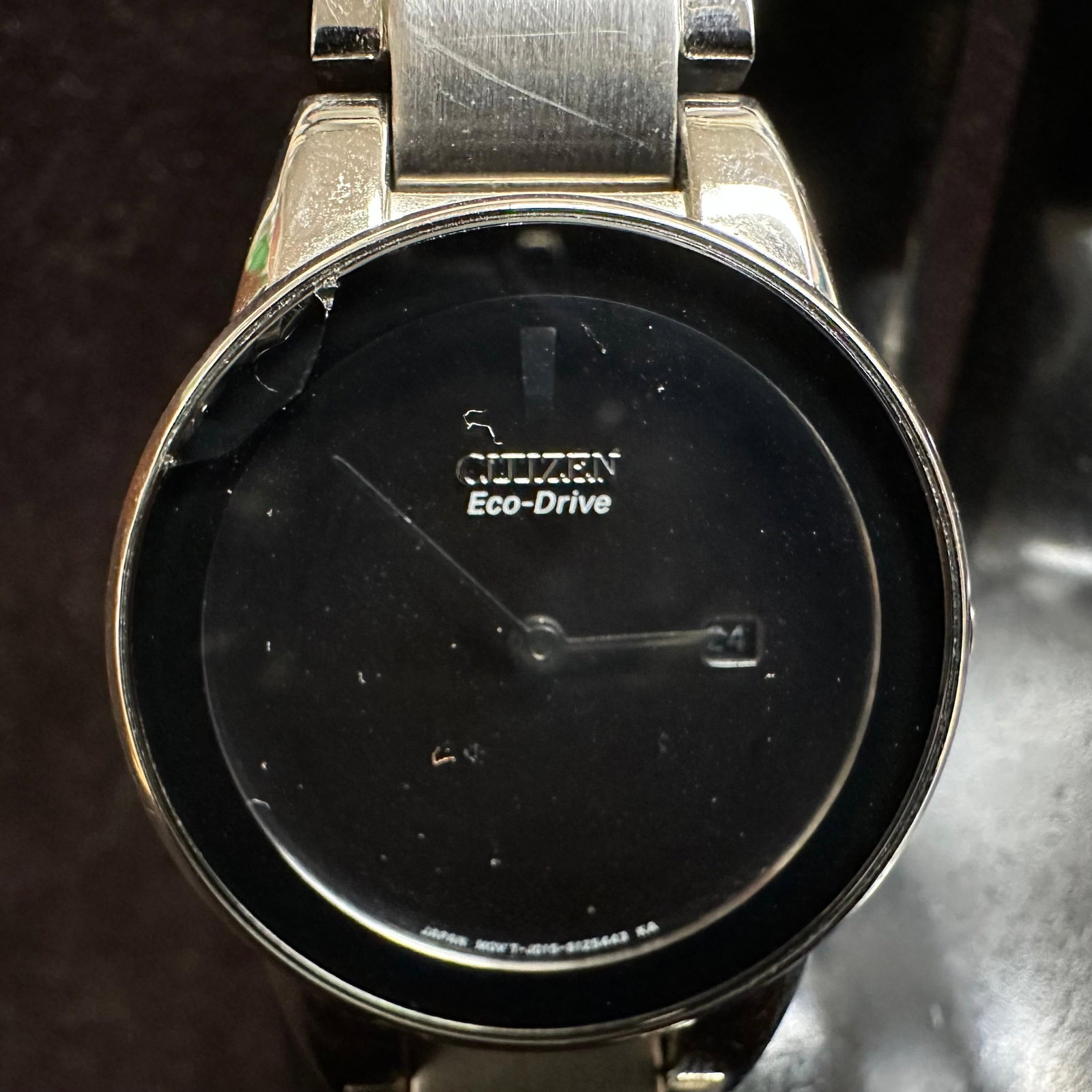 Citizen Eco-Drive Stainless Steel Wristwatch Black Dial Broken Band: Citizen Eco-Drive wristwatch featuring a black dial with date window, stainless steel case and bracelet, and Eco-Drive movement. Marked Japan movement. Water resistant. Watch shows surface wear and sc