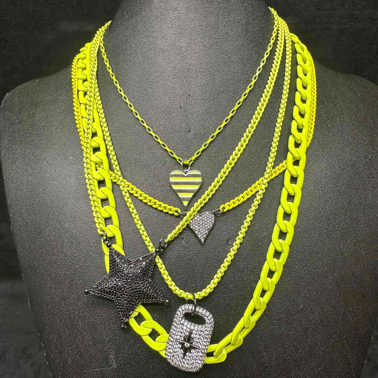 Melania Clara Assorted Necklace Lime Green Chain Rhinestone Pendant Set: The Alexa Rae and Melania Clara Lime Green necklace set features a magnet clasp closure. The necklaces have magnet extender clasp closures. Each necklace showcase modernist designs with black toned, h