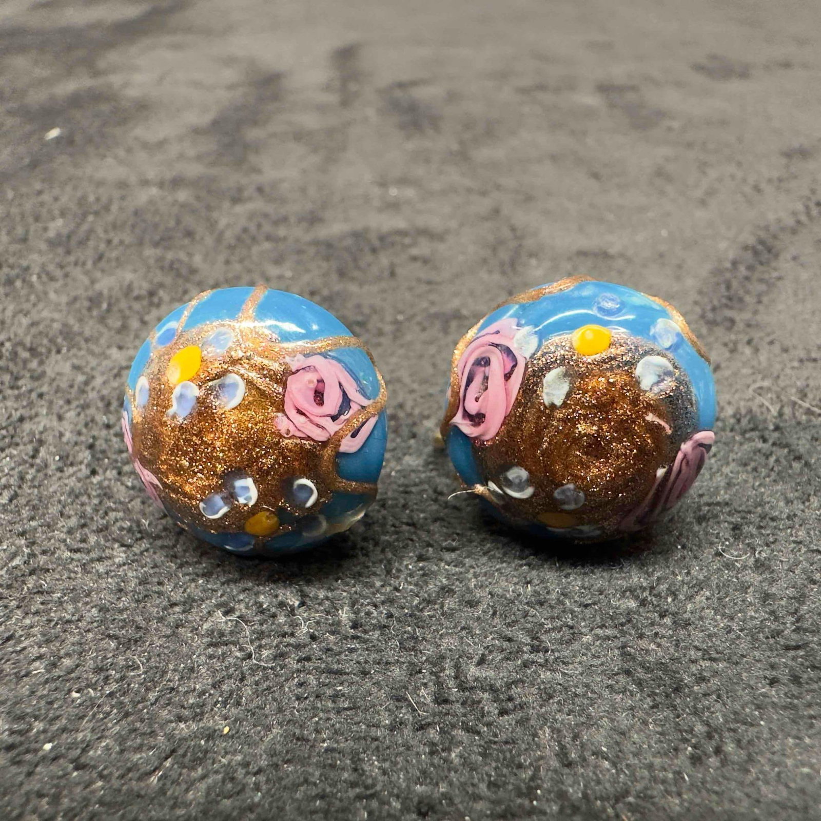 Murano Venetian Art Glass Lamp Work Blue Fiorato Floral Round Bead Earrings D42: Murano Venetian Art Glass Lamp Work Blue Fiorato Floral Round Bead Earrings D42. Earrings with blue colored glass beads with beautiful hand painted designs on each. The earrings feature floral and cop