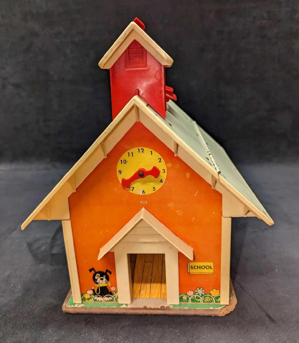 Fisher Price Vintage Little People Play Family School: Fisher Price Vintage Little People Play Family School. From the 1970s. Is approx 12" x 8" x 12 1/2" and it weighs 4.22lbs. The school has some markings on the plastic chalkboard, and wear on the