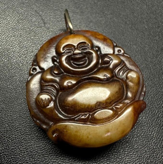 Brown Jade Buddha Pendant: This piece of jewelry has been tested and researched prior to listing. Please view all our pictures they are part of our description. DETAILS: Metal - Silver Color - Silver Stones - Brown Jade Hallma