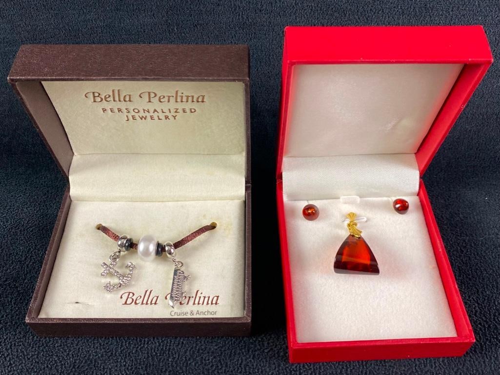 Cruise Charms & Faux Amber Pendant & Earrings: Cruise Charms & Faux Amber Pendant & Earrings Bella Perlina cruise and anchor charms and AM Double pendant and earrings in faux amber and brass. Both sets come in a box and are in good condit
