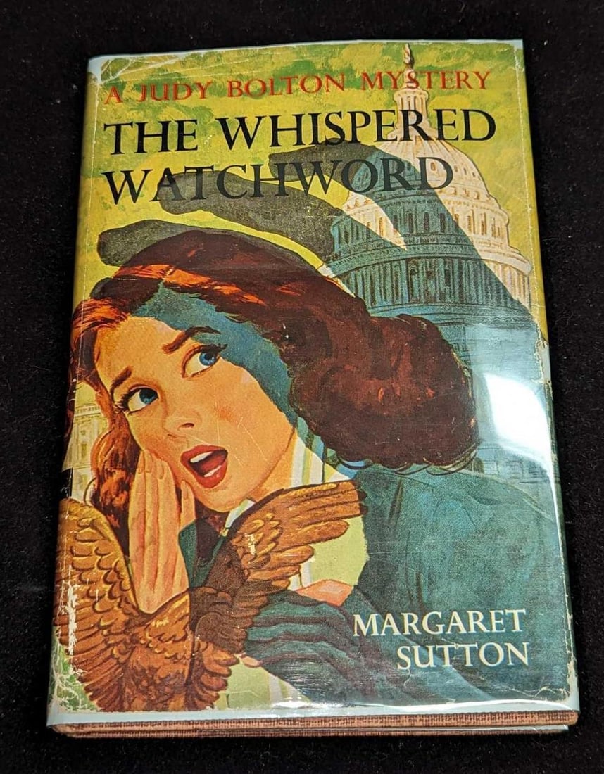 1st Ed Judy Bolton The Whispered Watchword #32 A: 1st Ed Judy Bolton The Whispered Watchword #32 A. "A Judy Bolton Mystery - The Whispered Watchword". By Margaret Sutton (The pen name of Rachel Beebe) and was published by Grosset & Dunlap (New York)