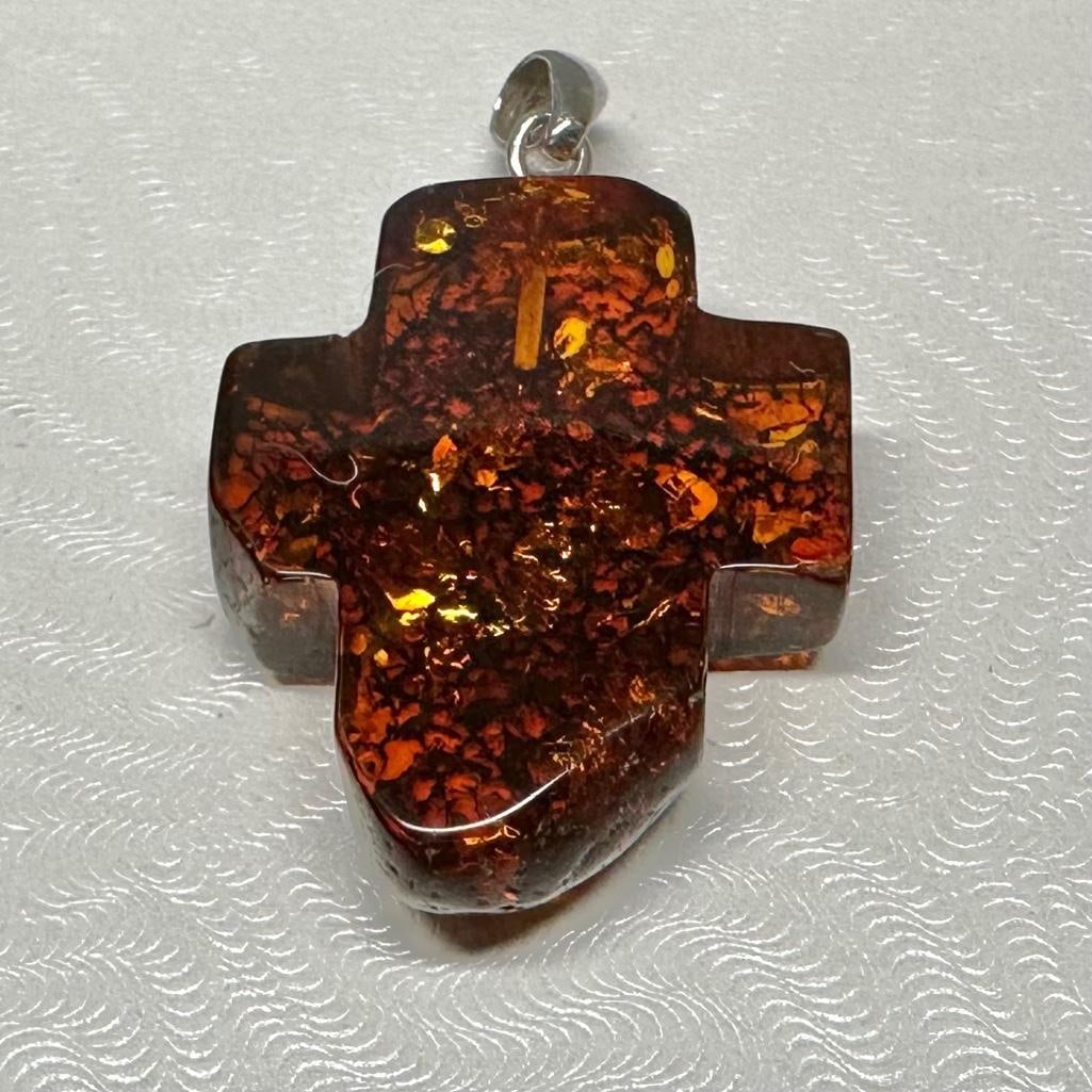 Sterling and Amber Cross Pendant: This piece of jewelry has been tested and researched prior to listing. Please view all our pictures they are part of our description. DETAILS: Metal - Sterling Silver Color - Silver Stones - Amber Ha
