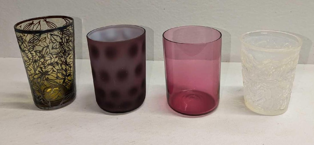 4 Vintage Different Drinking Glasses Tumblers: 4 Vintage Different Drinking Glasses Tumblers. This lot includes: (1) Plum Color Dot Pattern Glass Tumbler. This is approx 2 3/4" x 2 3/4" x 3 3/4". The glass has some markings from use a