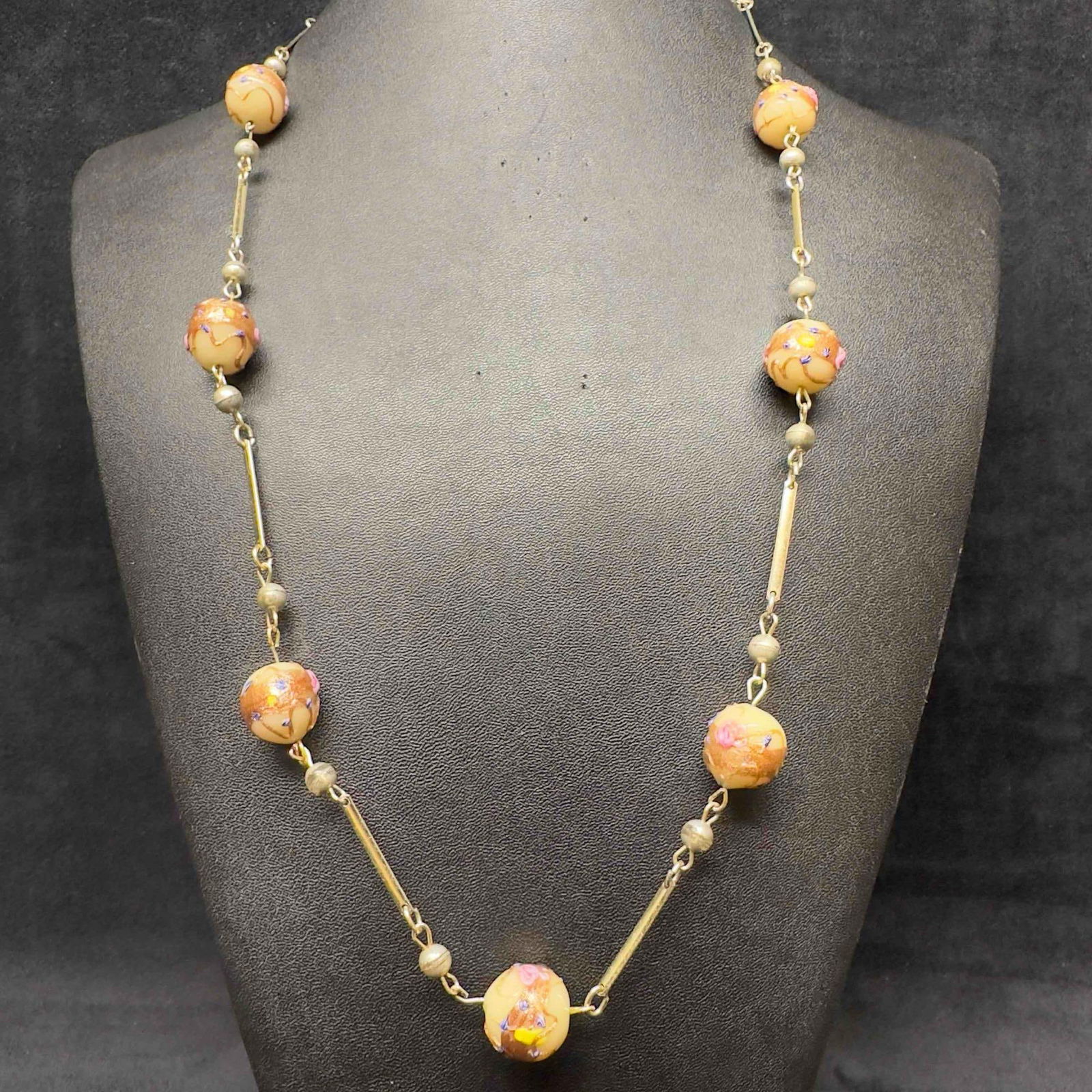 Venetian Murano Art Glass Lamp Work Cream Copper Floral Bead Beaded Long Necklace E38: Venetian Murano Art Glass Lamp Work Cream Copper Floral Bead Beaded Long Necklace E38. Necklace with cream colored glass beads with beautiful hand painted designs on each. The necklace features pink c