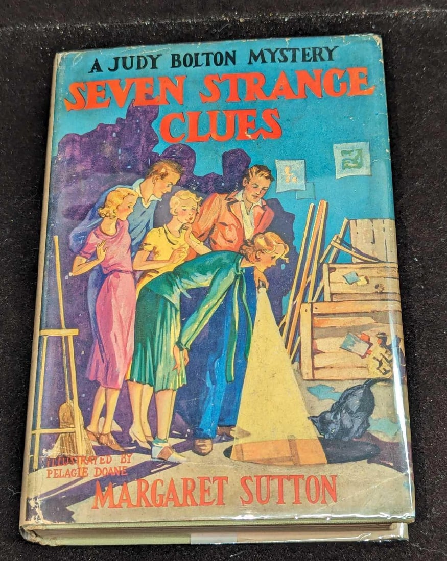 1st Ed Judy Bolton Seven Strange Clues HC #5: 1st Ed Judy Bolton Seven Strange Clues HC #5. "A Judy Bolton Mystery - Seven Strange Clues". By Margaret Sutton (The pen name of Rachel Beebe) and was published by Grosset & Dunlap (New York) and was
