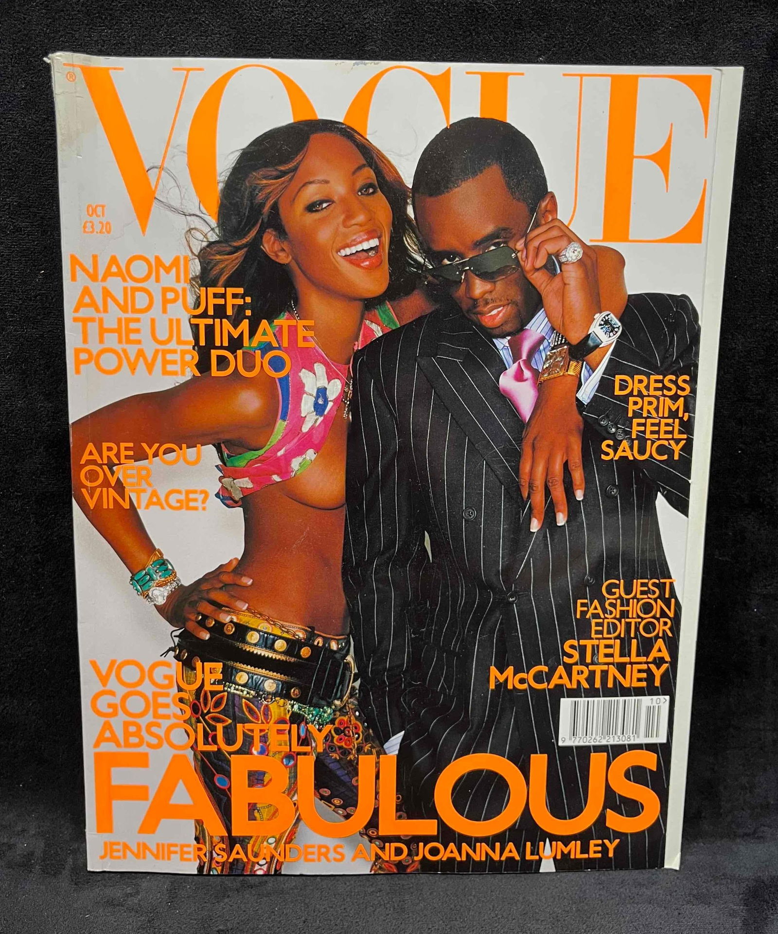 Vogue UK October 2001 Naomi Campbell & Puff Daddy: This lot contains a Vogue UK October 2001 Naomi Campbell & Puff Daddy. It is approx 11 /4" x 8 3/4" and it weighs about 2.8lbs. Overall the magazine is in good used condition with some minor shel
