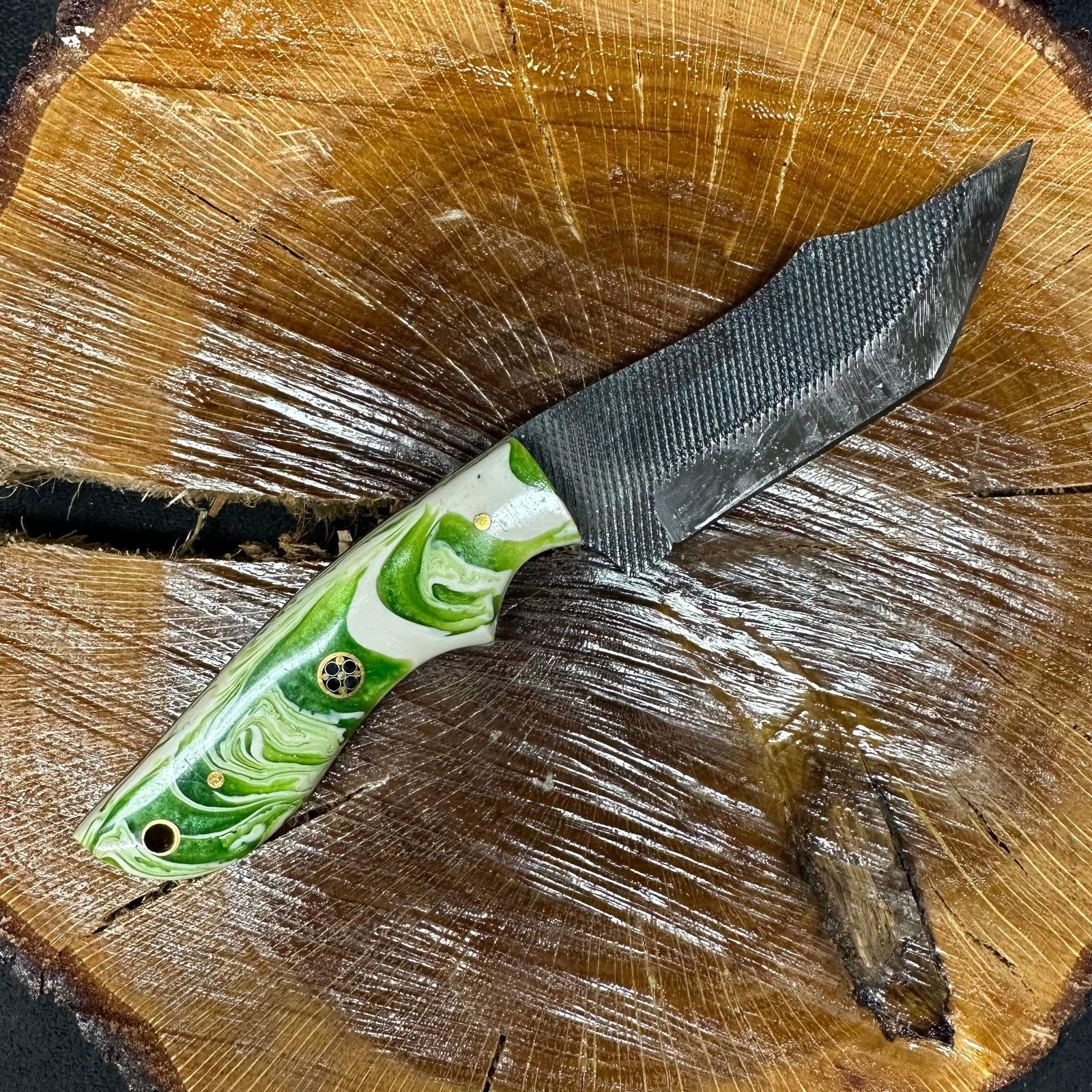 MHS Cutlery Clip Point Blade Knife P91 Green White Handle: Fixed blade knife by MHS Cutlery featuring a layered pattern steel blade and decorative spine work. The handle has a contoured, green and white colored wood/epoxy resin-style grip with metal mosaic pi