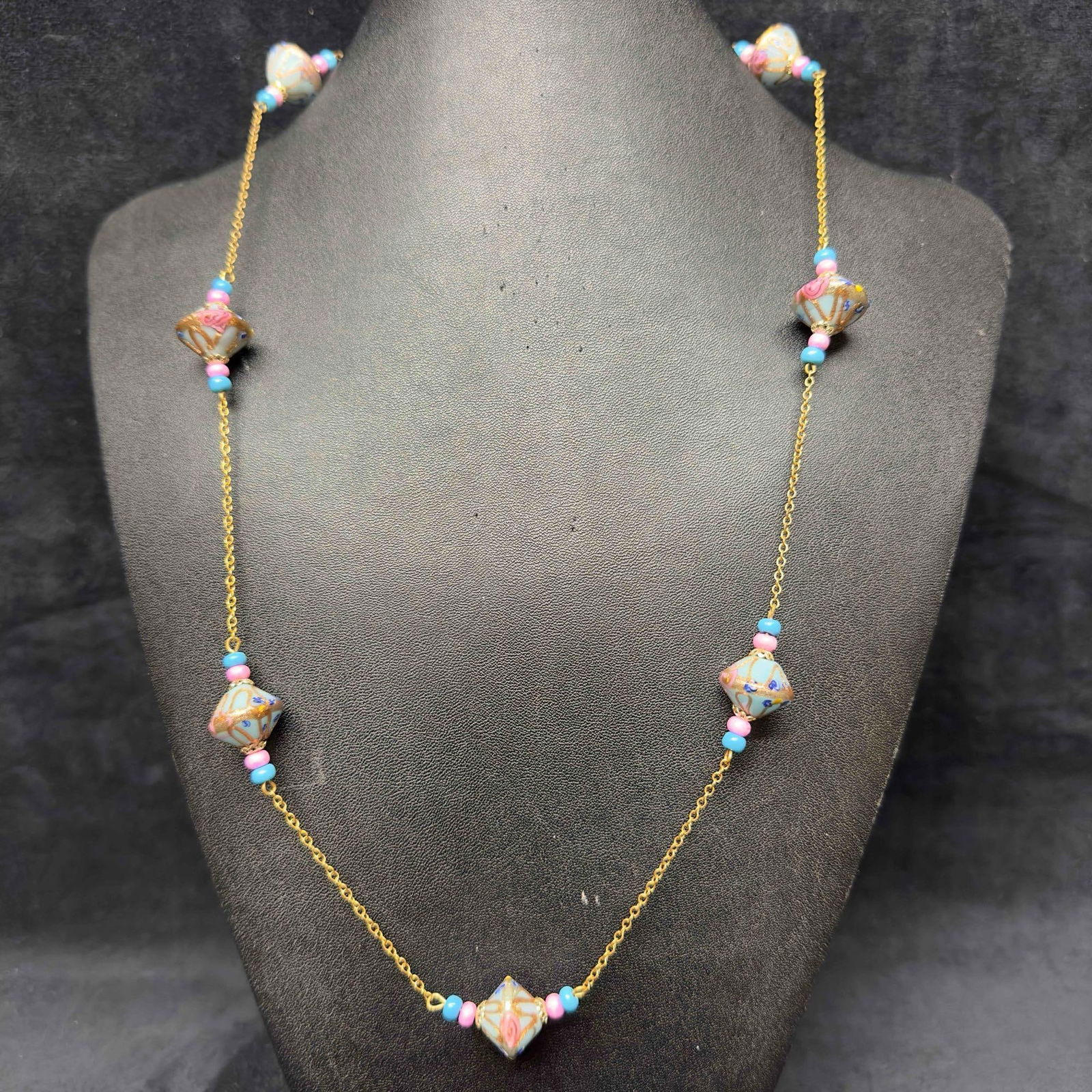 Murano Venetian Lamp Work Art Glass Baby Blue Pink Beaded Gold Toned Chain Necklace C5: Murano Venetian Lamp Work Art Glass Baby Blue Pink Beaded Gold Toned Chain Necklace C5. Necklace with baby blue colored glass beads with beautiful hand painted designs on each. The necklace features c