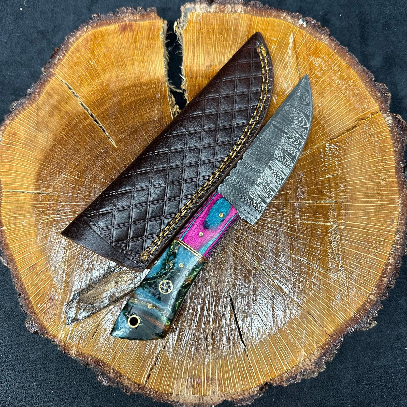 MHS Cutlery Blade Knife Unique Designed Handle Q21 Pink Color: Fixed blade knife by MHS Cutlery featuring a layered patterned steel blade and decorative spine work. The handle has a contoured, multi-colored wood/epoxy resin-style grip with metal mosaic pin accent