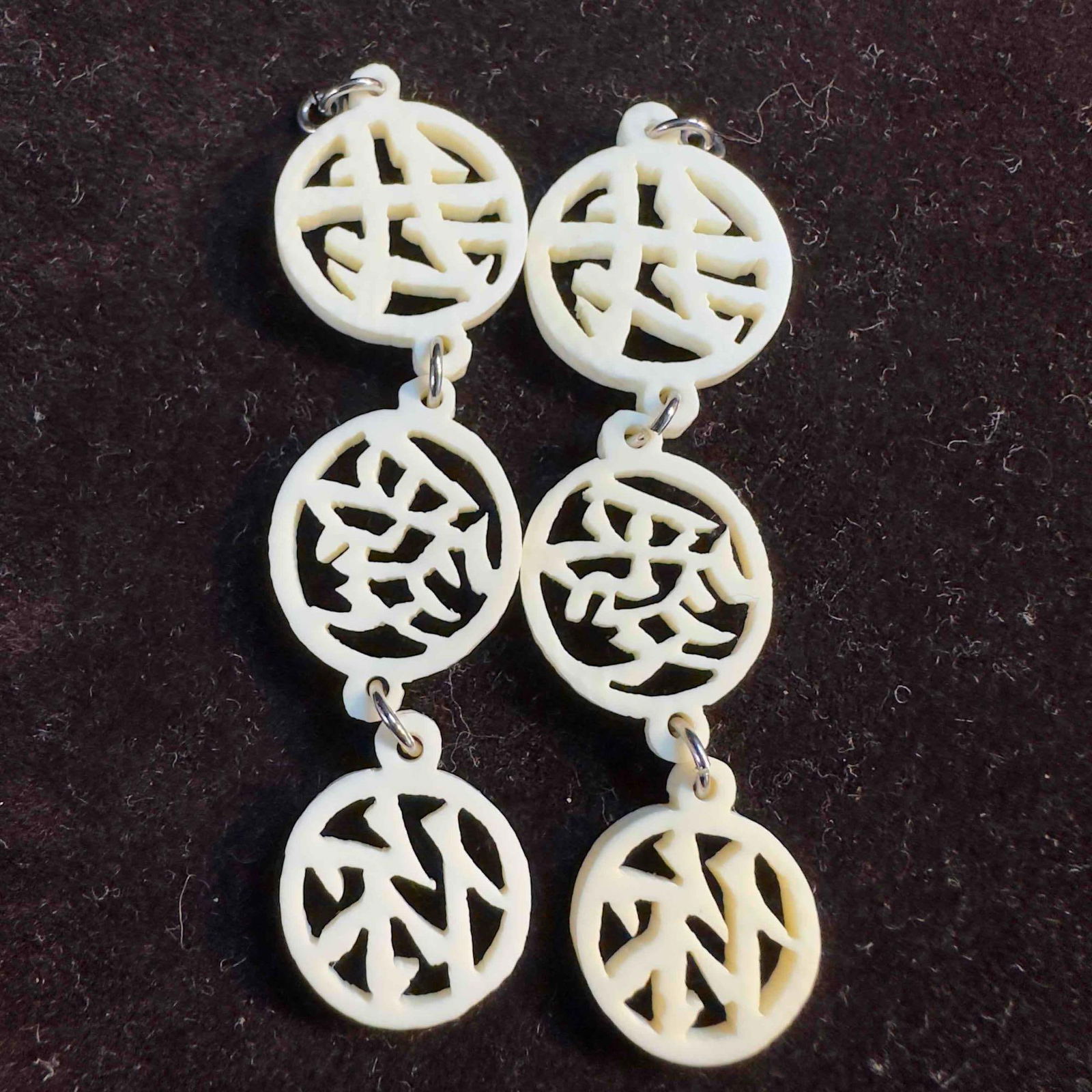 Hand Carved Bone Mid Century Asian Characters Drop Earrings: Hand Carved Bone Mid Century Asian Characters Drop Earrings. The earrings feature no clasp closure. This item is in good pre-owned, previously displayed condition with light wear, and surface