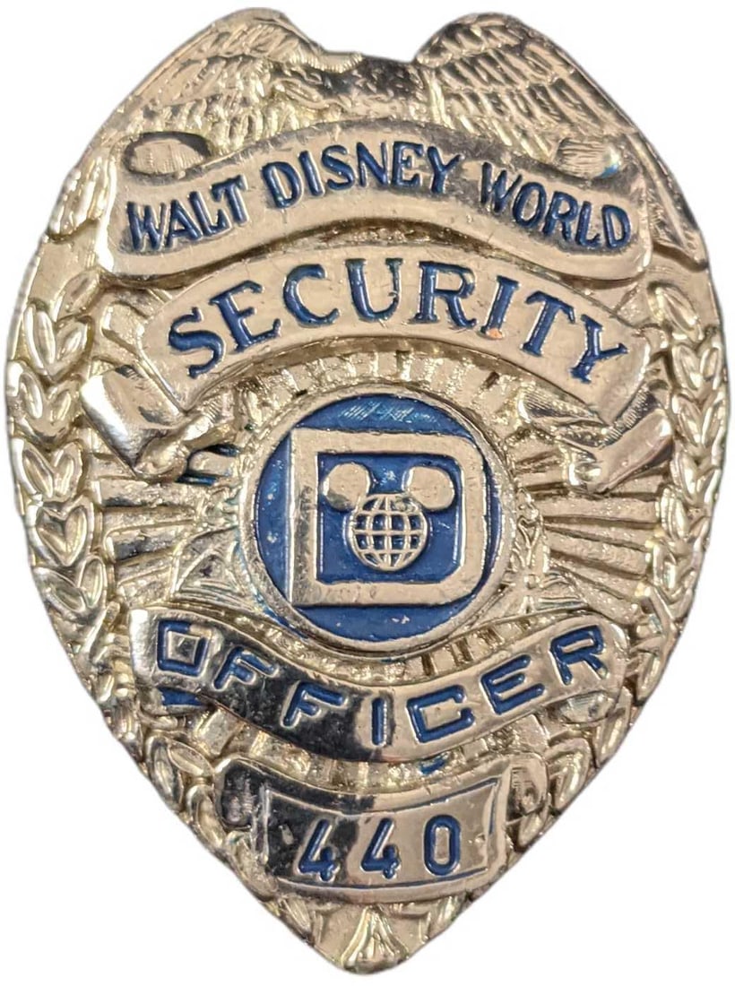 Early 1980s Disney World Female Security Badge: 1970/1980s Disney World Female Security Metal Badge. Is approx 1 1/2" x 1" x 2" and it weighs under one pound at 0.11lb. The metal badge is in a good, vintage condition with some wear and small scratc