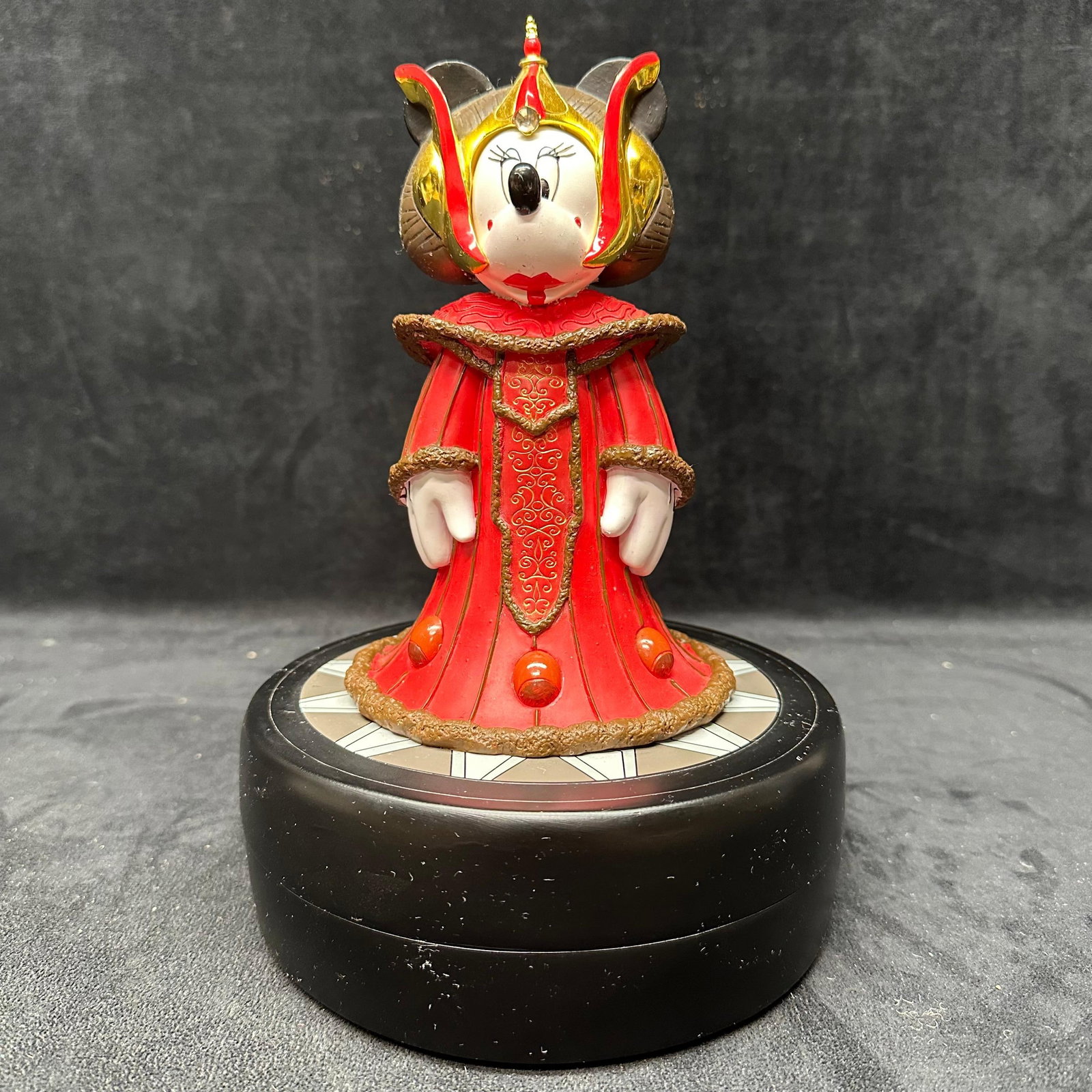 Disney Parks Star Wars Weekends Minnie Mouse as Queen Amidala Figure Keepsake: Decorative Minnie Mouse figure dressed as Queen Amidala from Star Wars Weekends. Produced for Disney Parks and designed by Costa Alavezos. Marked limited edition. Mounted on original base. One red gem