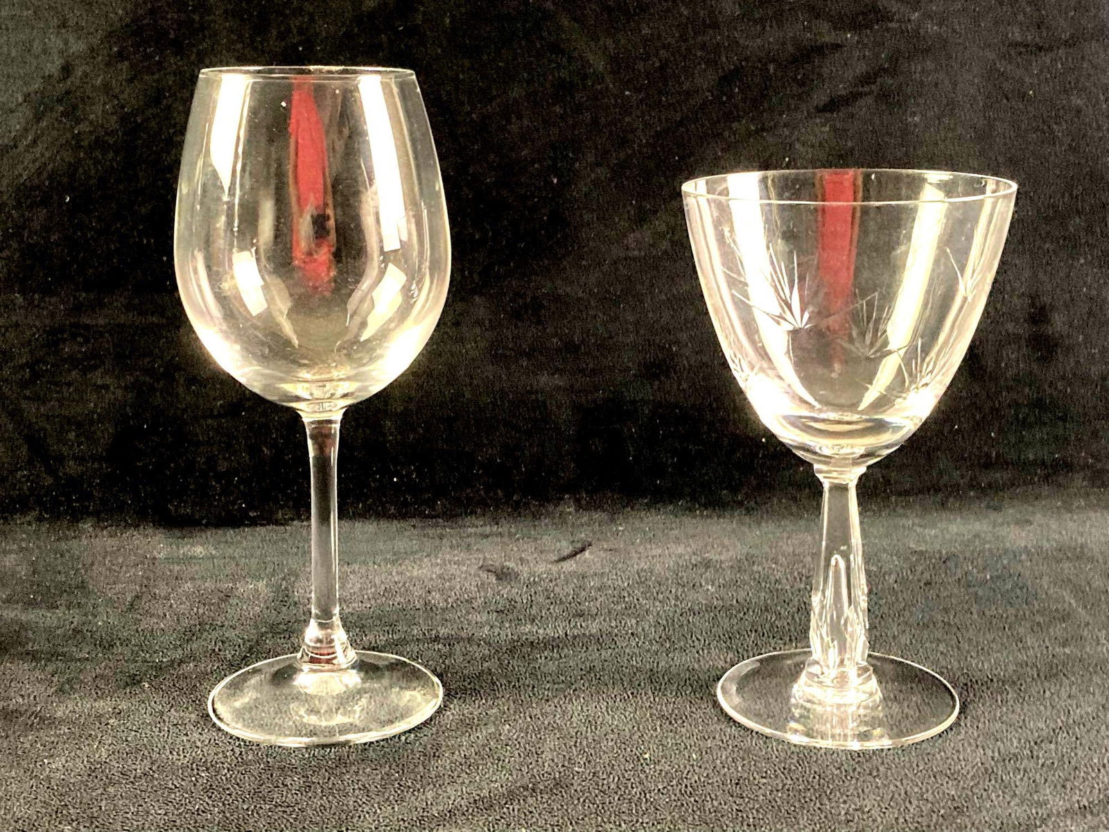 Set of (2) Glass Wine Glasses: This lot includes: (1) Decorative Wine Glass (1) Standard Wine Glass Condition is used and refer to photographs for additional details. The glasses show no signs of chipping