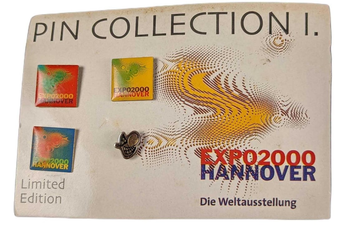 Rare German Expo2000 Worlds Fair Pin Collection 1: Rare German Expo2000 Worlds Fair Pin Collection 1. This comes with four different pins, which are all connected to one card. This card is approx 4 3/4" x 3". The card and pins are in a good, used