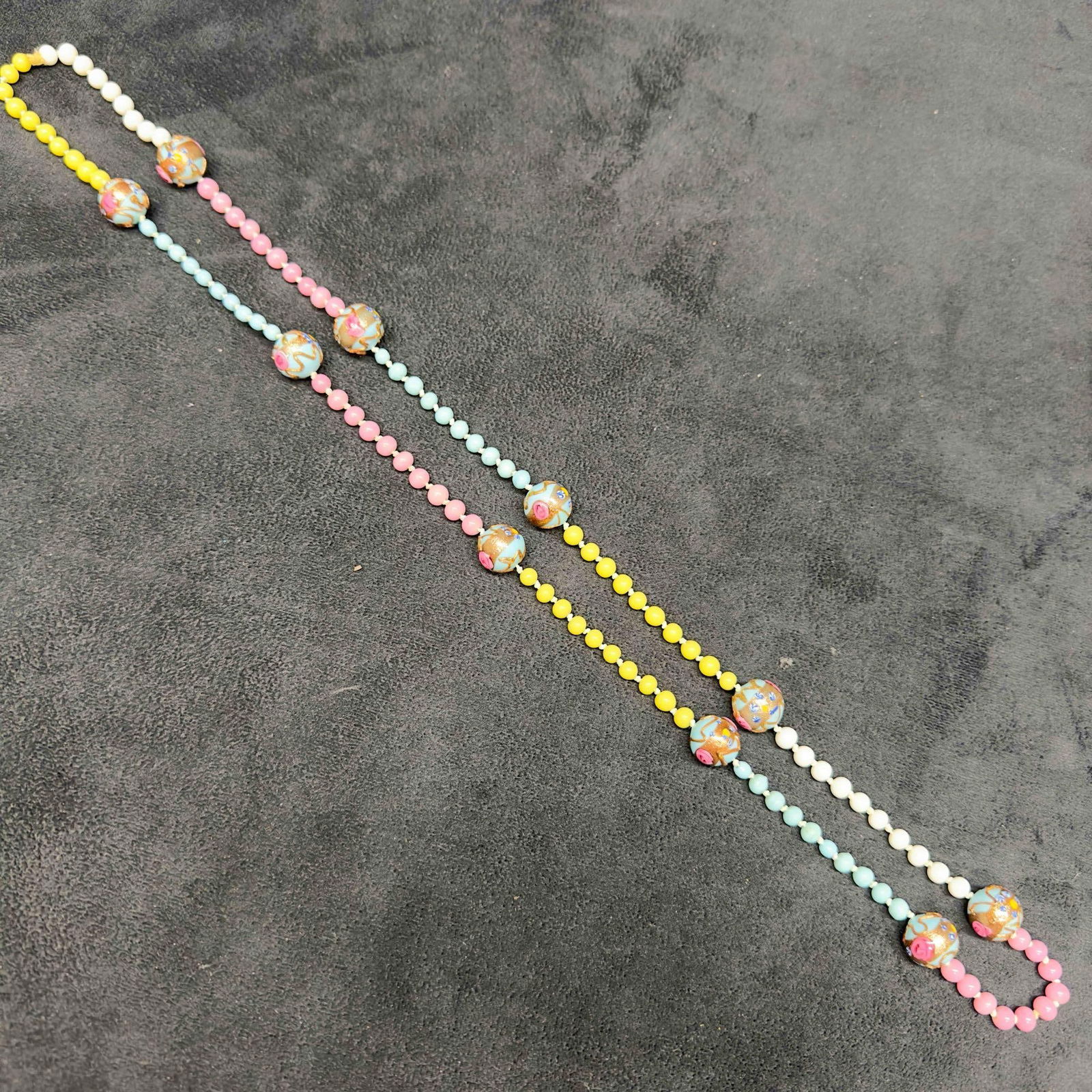 Venetian Murano Art Glass Lamp Work Light Blue Round Bright Pink Yellow White Beaded Necklace E37: Venetian Murano Art Glass Lamp Work Light Blue Round Bright Pink Yellow White Beaded Necklace E37. Necklace with light blue glass beads with beautiful hand painted designs on each. The necklace featur