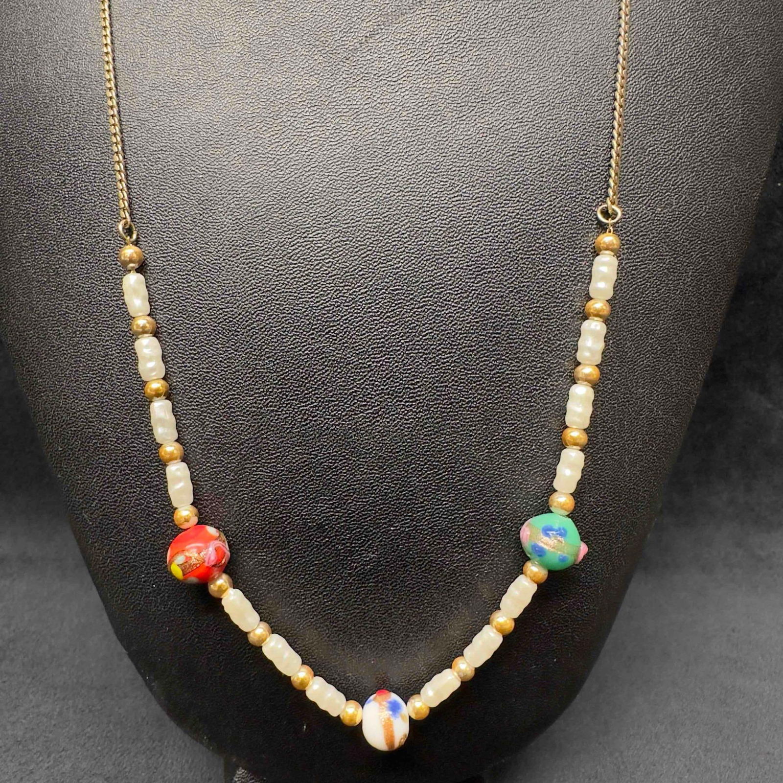 Venetian Murano Lamp Work Art Glass Multi Colored Beaded White Accent Small Necklace F86: Venetian Murano Lamp Work Art Glass Multi Colored Beaded White Accent Small Necklace F86. Necklace with multi colored glass beads with beautiful designs on each. The necklace features floral and white