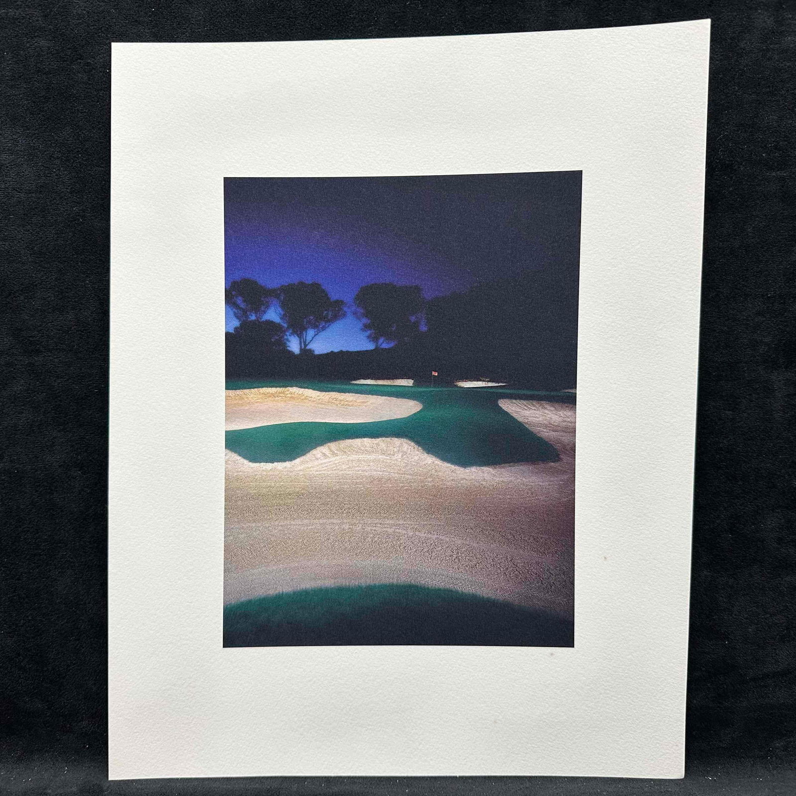 Fine Art Print Lithograph Golf Course Sunset Bunker Landscape GC1: High-quality lithograph photo print depicting a dramatic golf course landscape at sunset, featuring multiple sand bunkers and a glowing blue-dark sky. Printed on textured, heavyweight paper for a gall