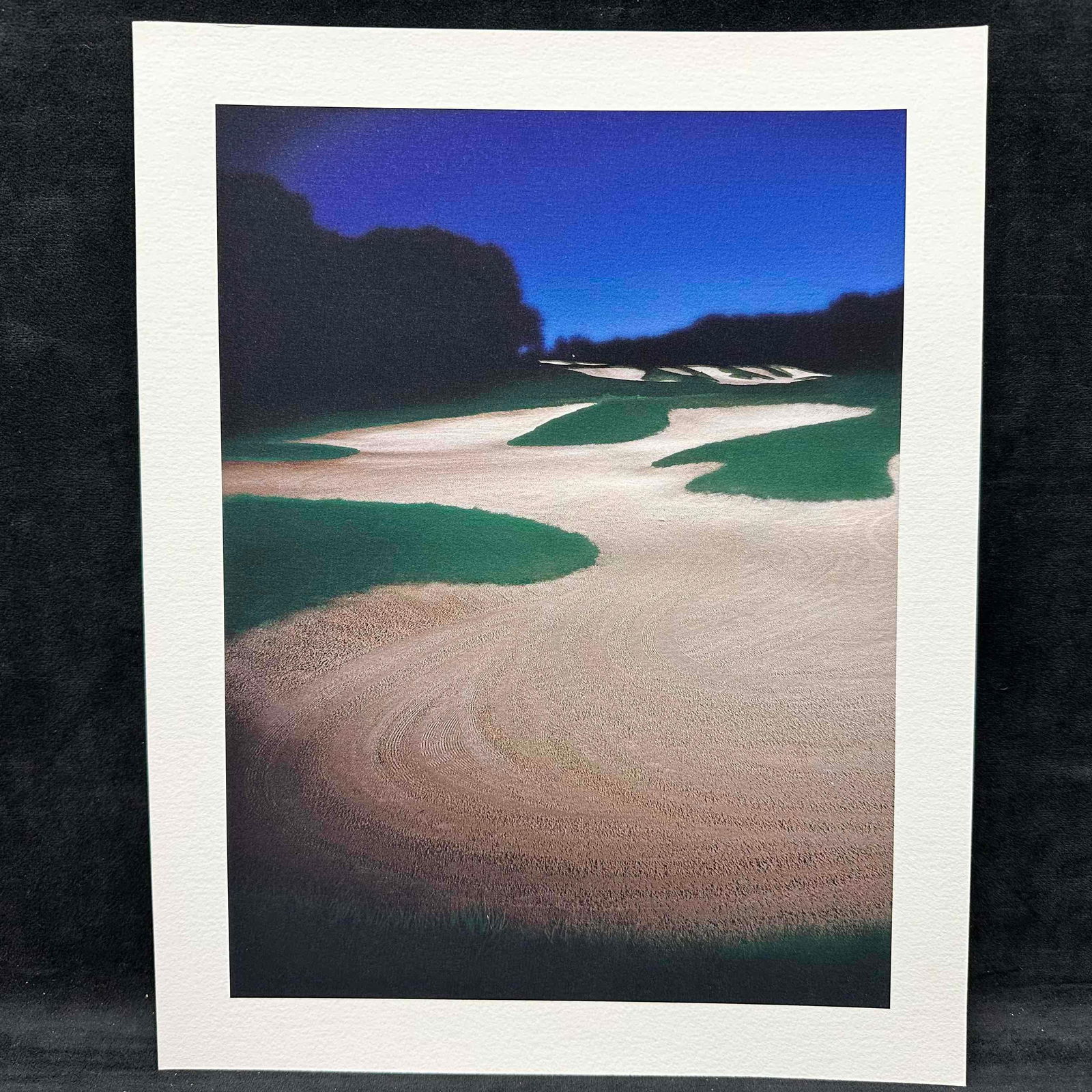 Fine Art Print Lithograph Golf Course Scenic Sand Trap and Fairway Night Scene GC4: High-quality lithograph featuring a striking view of a golf course with winding sand bunkers under a deep blue sky. Printed on textured, heavyweight paper for a gallery-quality look and feel. This ite