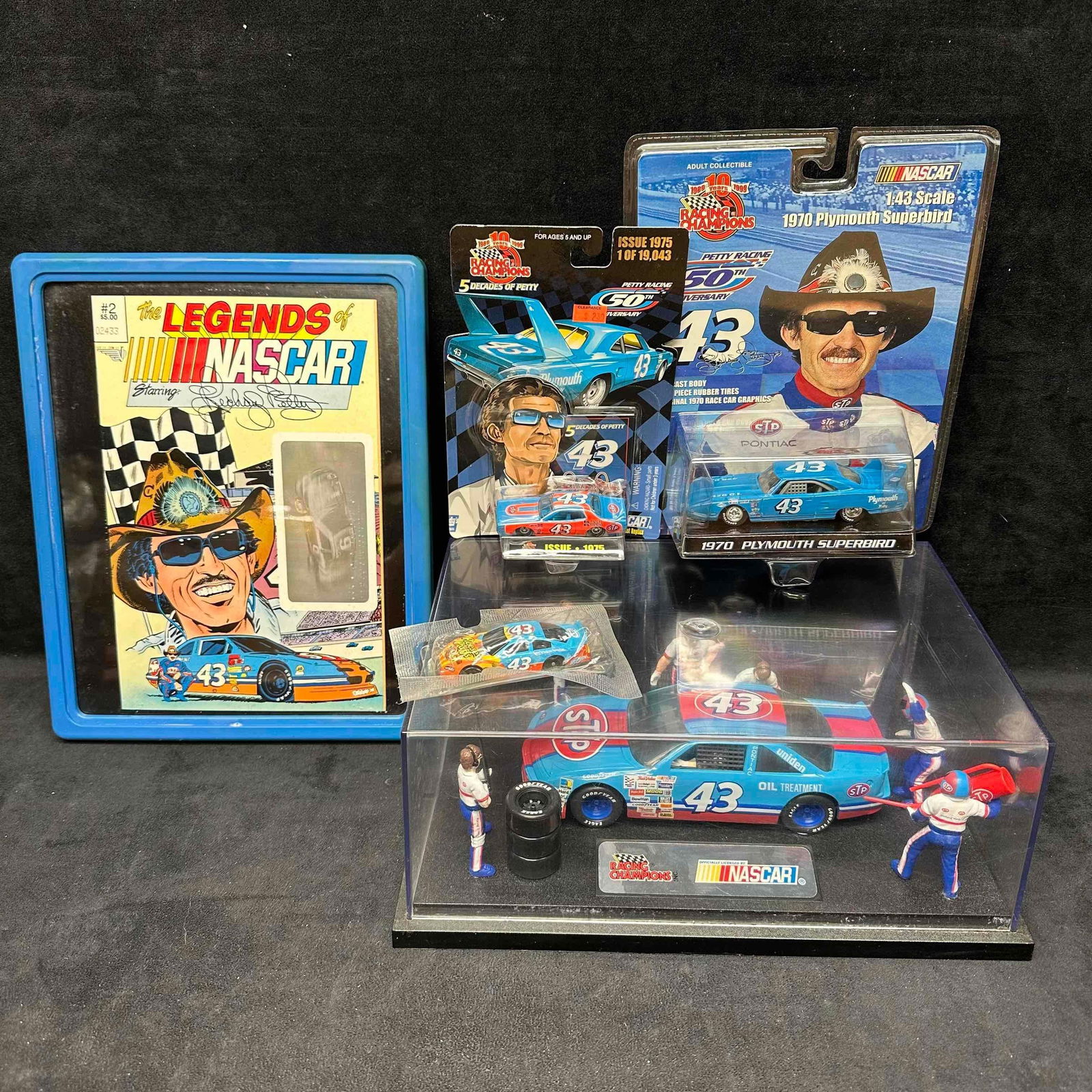 Richard Petty 43 Collectible Die Cast Cars Legends NASCAR Comic Set: Richard Petty 43 Collectible Die Cast Cars Legends NASCAR Comic Set. This collection of Richard Petty collectibles feature a framed comic and some die cast cars. Some of these collectibles are in like