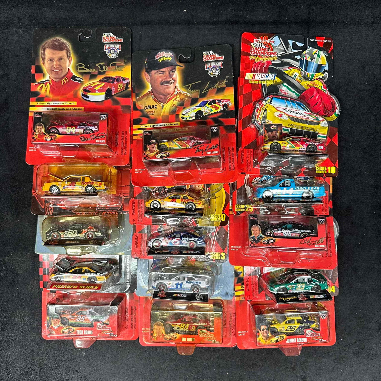 Set of 15 Racing Champions NASCAR Diecast Cars Various Drivers 1:64 Scale: Collection of fifteen Racing Champions NASCAR 1:64 scale diecast cars, each sealed in original blister packaging. Includes a mix of drivers such as Bill Elliott, Todd Bodine, Johnny Benson, Terry Labo