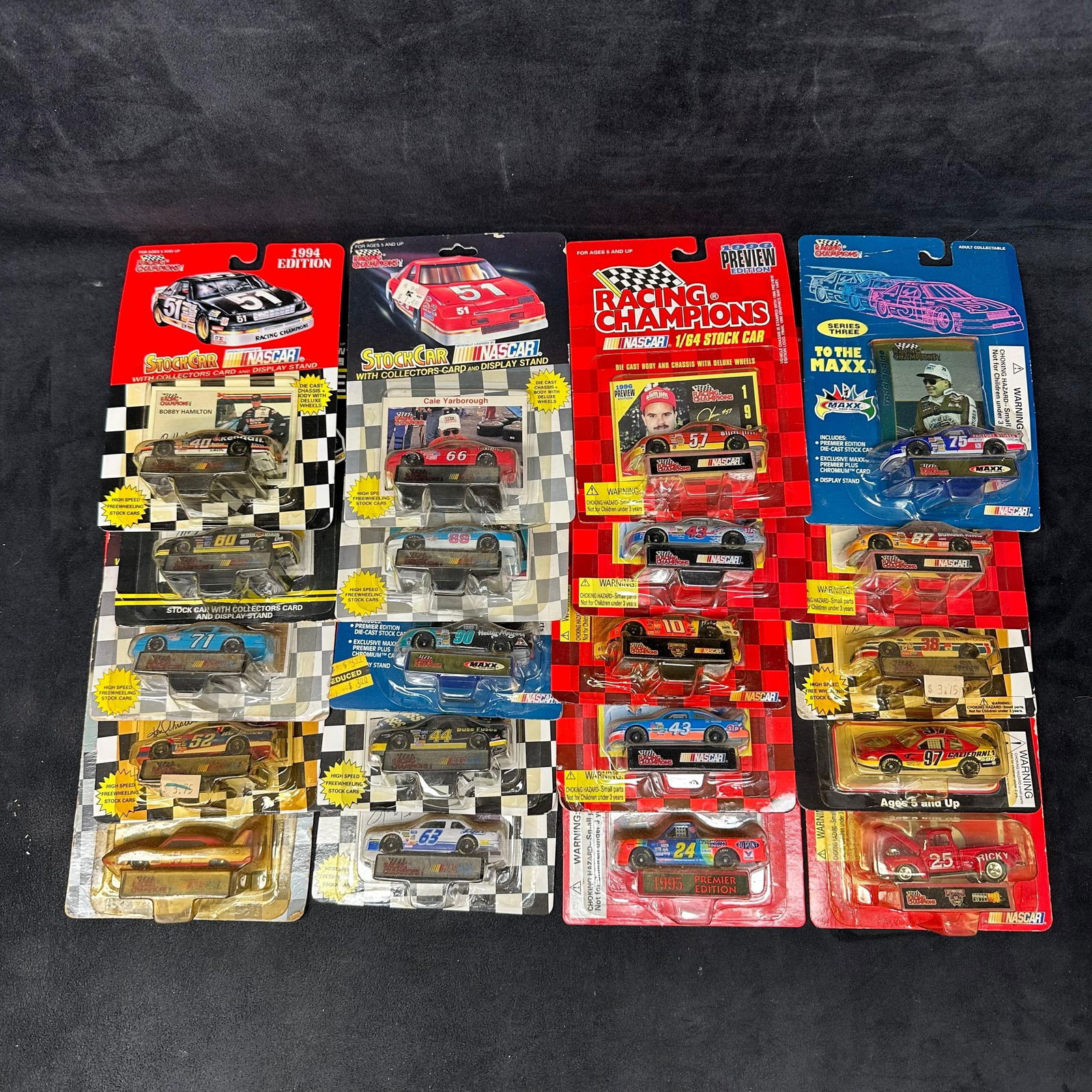 Racing Champions 1:64 Scale Collectors Twenty NASCAR Replica Stock Cars Set A: Various variety of NASCAR replica stock 1:64 scale die-cast cars from Racing Champions and Revell. Several NASCAR sponsor brands featured. These collectibles are in like-new condition, never being rem