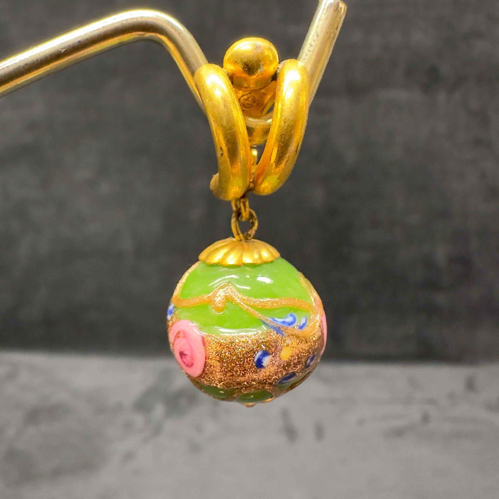 Murano Venetian Art Glass Lamp Work Dark Green Round Bead Gold Toned Drop Dangle Earrings G90: Murano Venetian Art Glass Lamp Work Dark Green Round Bead Gold Toned Drop Dangle Earrings G90. Earrings with green colored glass beads with beautiful designs on each. The earrings feature copper color