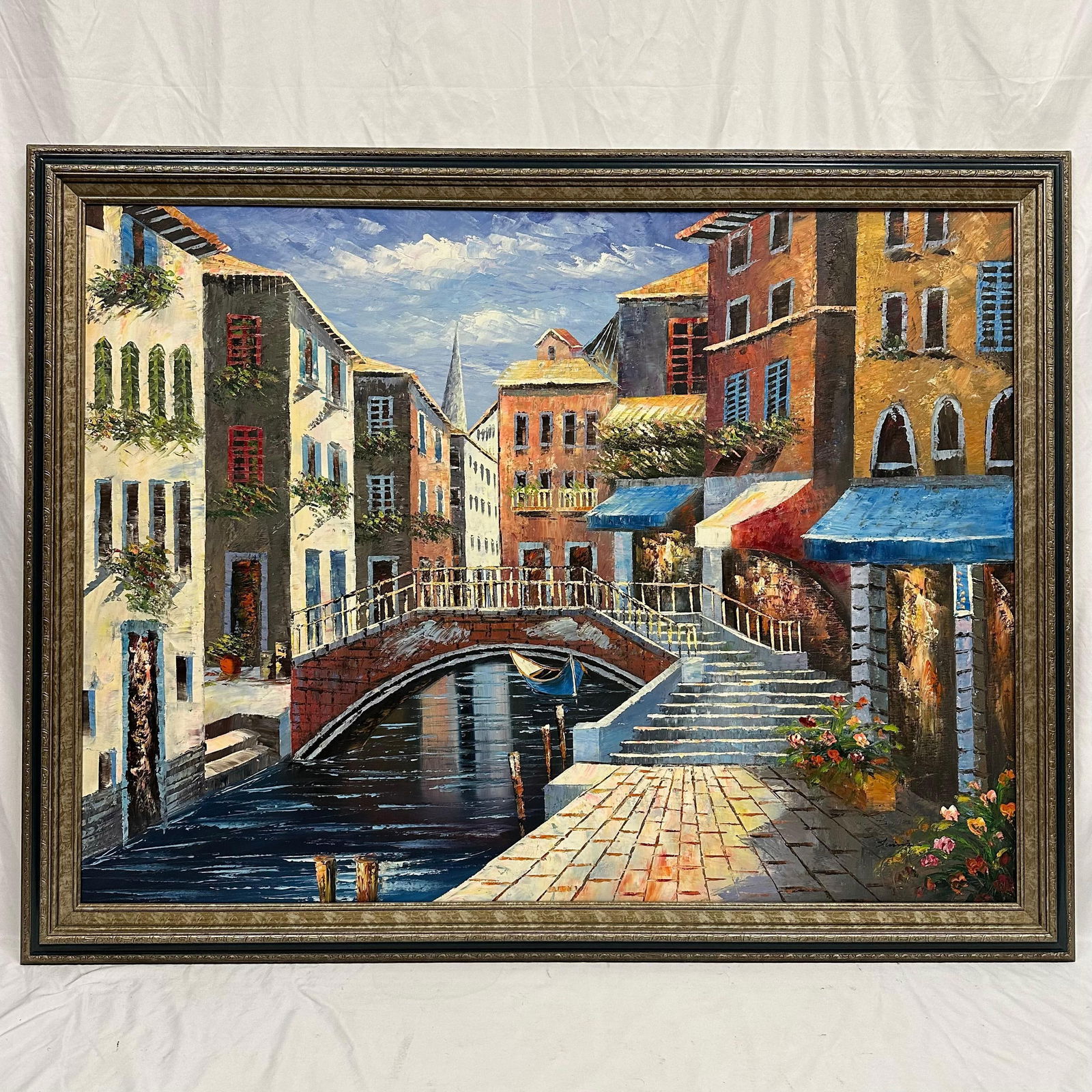 Venice Canal Oil Painting on Canvas Bridge Boats and Colorful Buildings Signed Framed: Original oil painting on canvas signed, unknown artist, depicting a bright canal scene with an arched bridge, a docked gondola, and colorful Venetian buildings with flowered balconies. Framed in an or