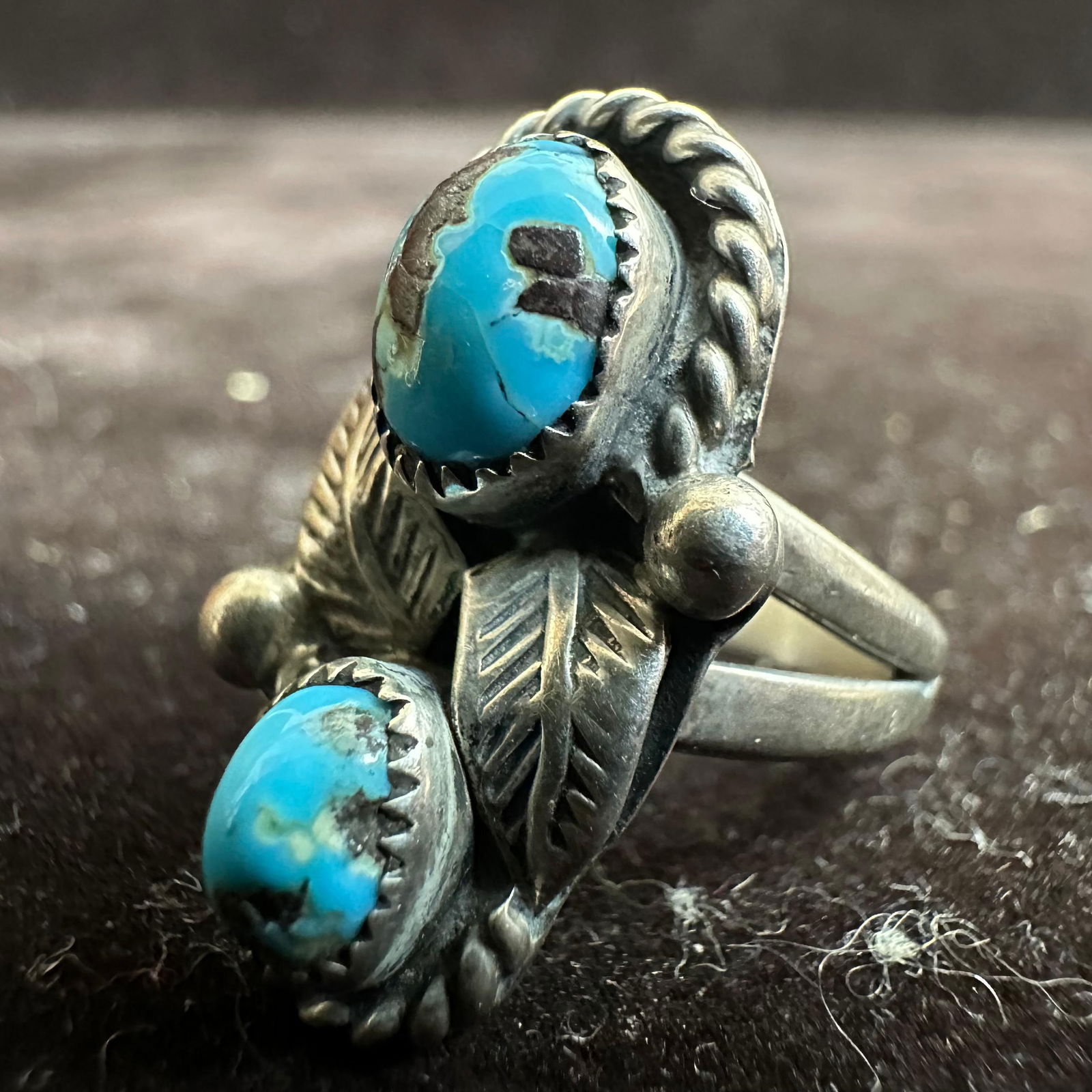 Navajo C. Davis Two Stone Turquoise Feather Motif Silver Ring: This item is in good pre-owned, previously used/displayed condition with noticeable light wear and surface scratches. Please reference all photos for full details. This piece of jewelry has been teste