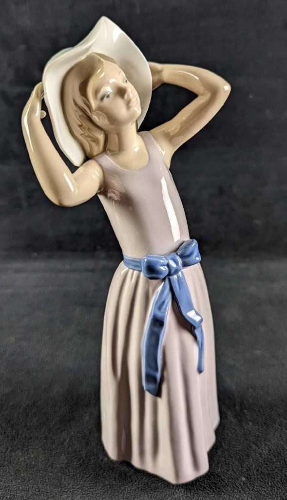 Retired Lladro Trying On A Straw Hat Girl Figurine (1 of 6)