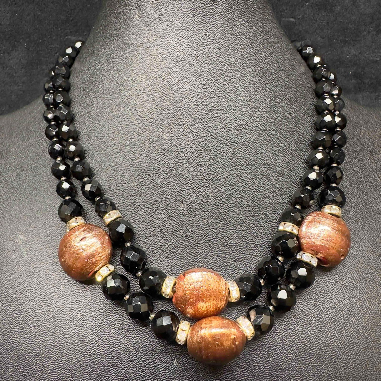 Murano Venetian Lamp Work Art Glass Copper Colored Black Bead Accent Double Layered Necklace H1: Murano Venetian Lamp Work Art Glass Copper Colored Black Bead Accent Double Layered Necklace H1. Necklace with copper and black colored glass beads with beautiful designs on each. The necklace feature