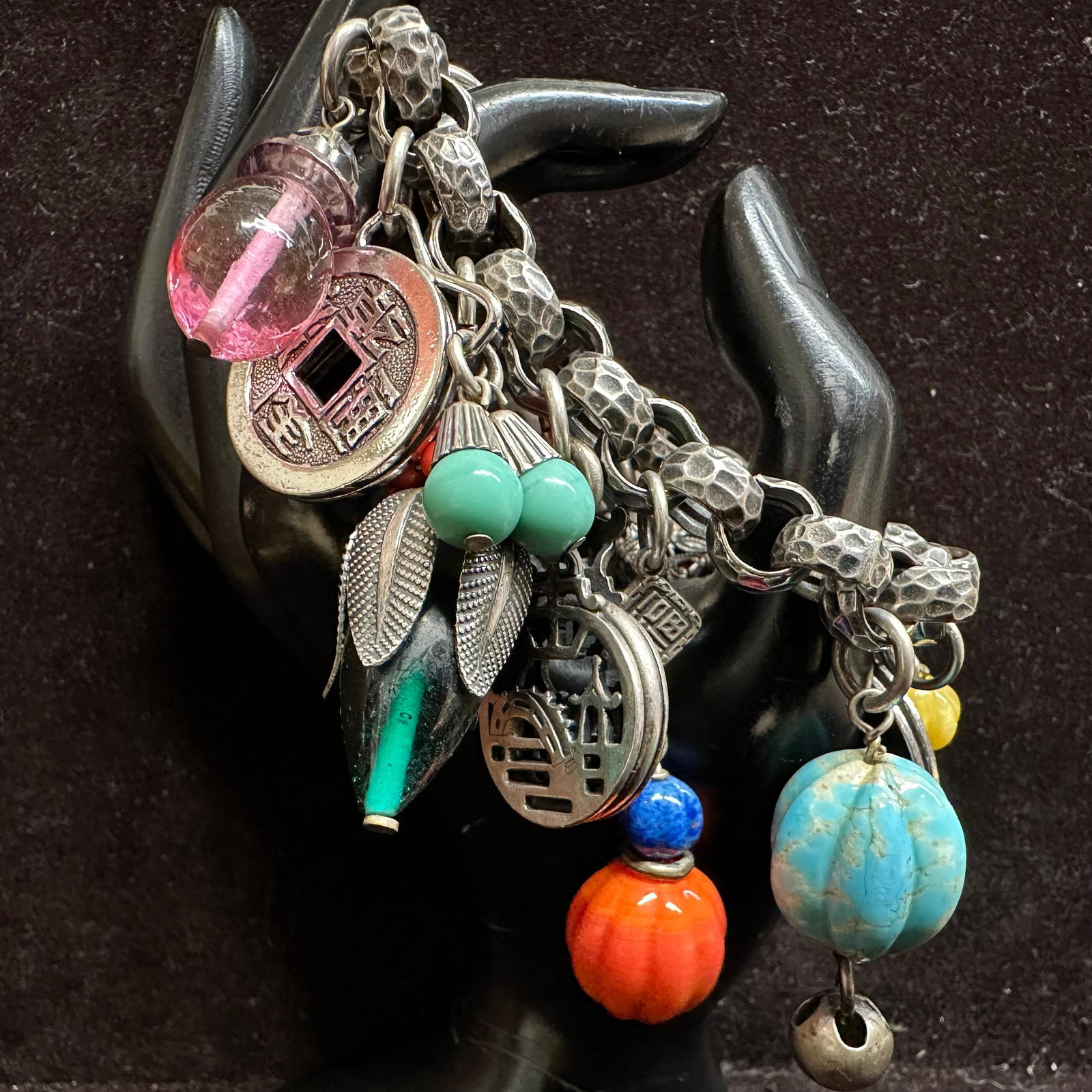 Napier Asian-Inspired Silver Toned Metal Glass Charm Bracelet Mixed Charms Dragon Lantern Symbols: Napier Asian Inspired Metal Glass Art Charm Bracelet Featuring Chunky Charms Made From a Variety of Materials on Silver Tone Link Bracelet. Bracelet measures 7 3/4 inches, and charms average about 1 i