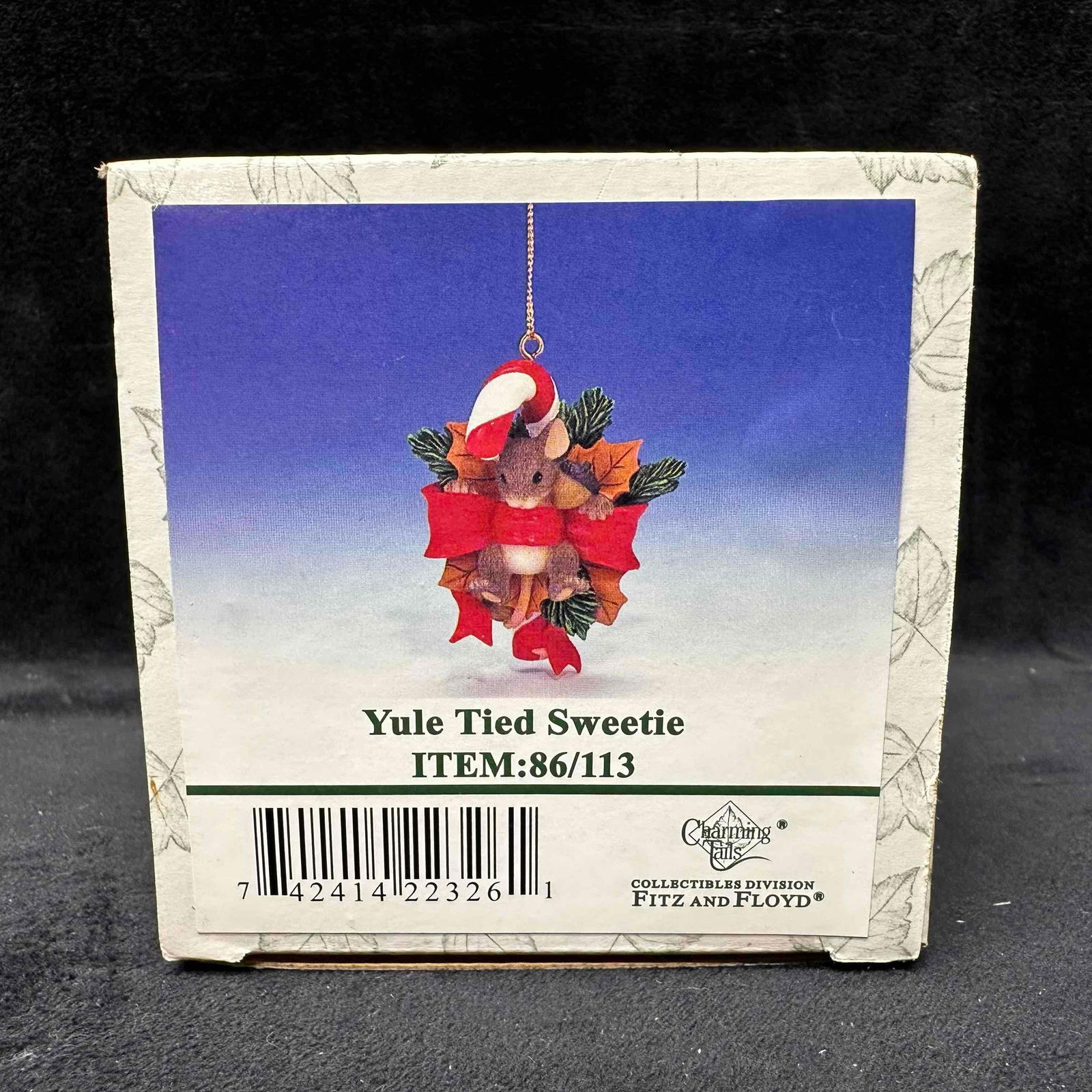 Charming Tails by Fitz and Floyd Yule Tied Sweetie Ornament: Charming Tails collectible ornament titled Yule Tied Sweetie by Fitz and Floyd, item #86/113. Features a festive mouse wrapped in a red ribbon with a candy cane and holly. Includes original box, Styro