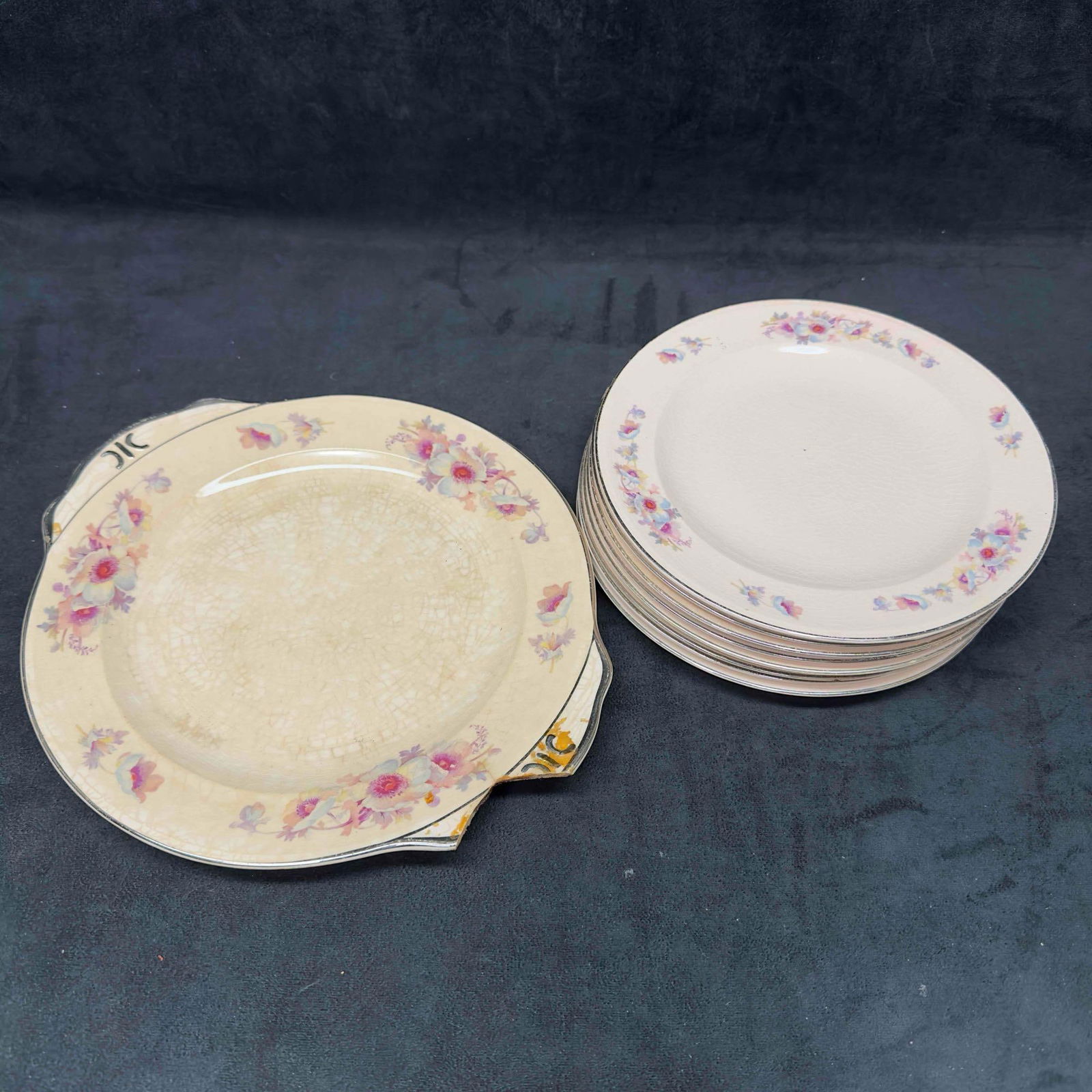 Royal Beige Ware Blue Moon Plate Set Nine Pink Floral Plates: Royal Beige Ware Blue Moon Plate Set Nine Pink Floral Plates . Markings on the bottom of each plate. Floral design on the front of the plates edges. Includes eight (8) plates and one (1) serving plate