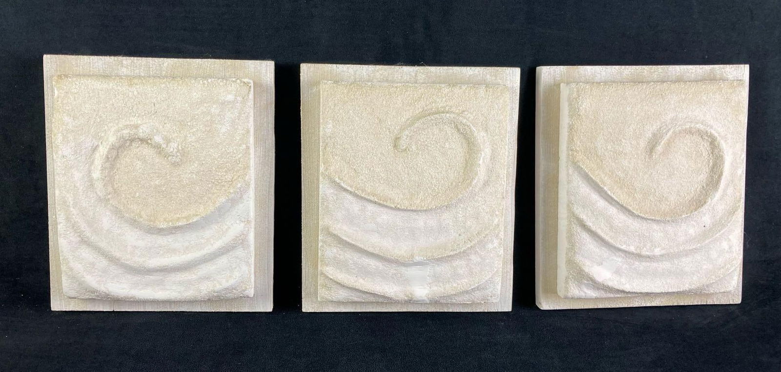(3) Plaster and Wood Swirl House Decorations: Up for auction are three swirl wall decorations fresh from a recent estate. They are all white plaster swirl or wind designed wall mounts. The plaster are on wood boards ready for wall display. This a